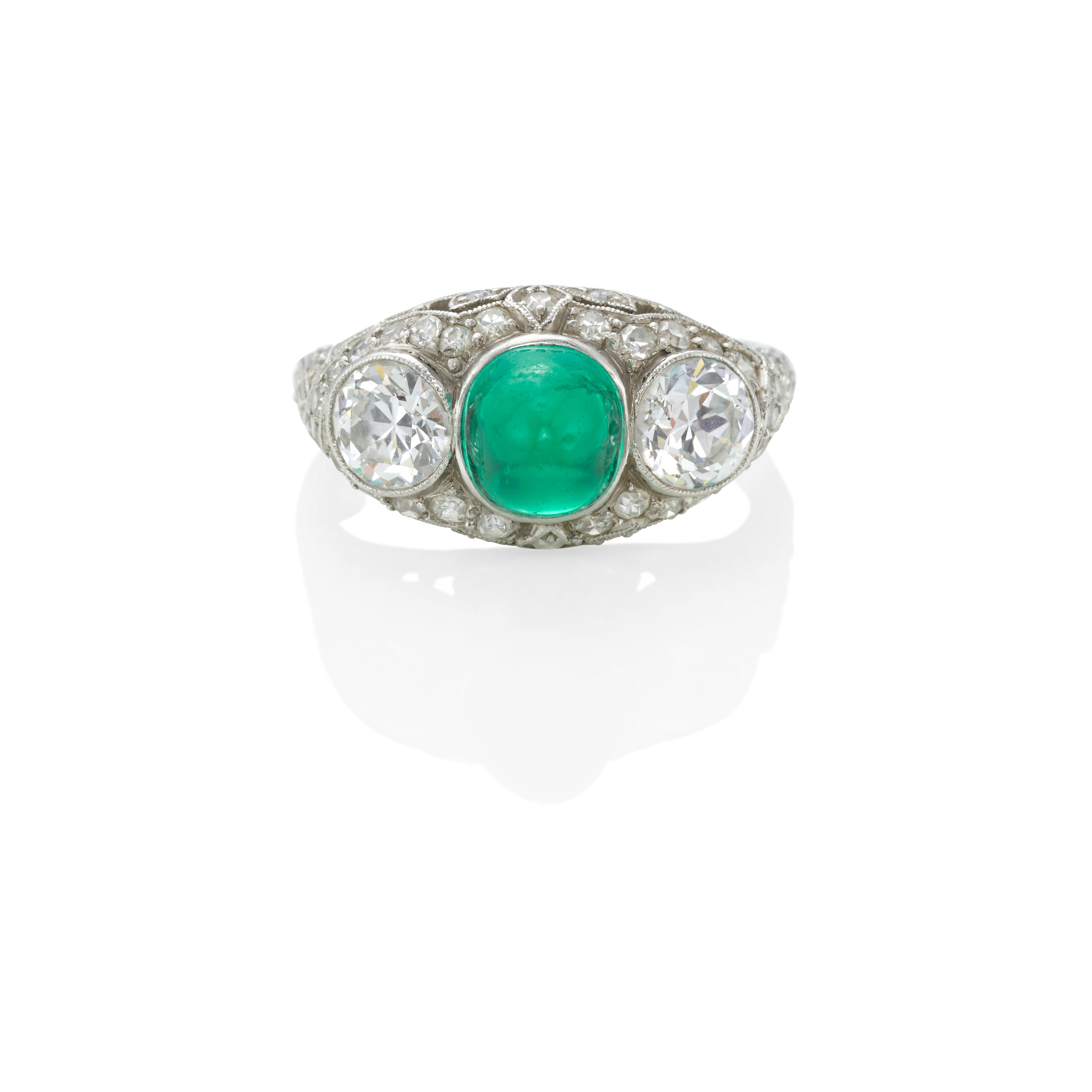 Appraisal: A PLATINUM EMERALD AND DIAMOND RING Centering a sugarloaf emerald