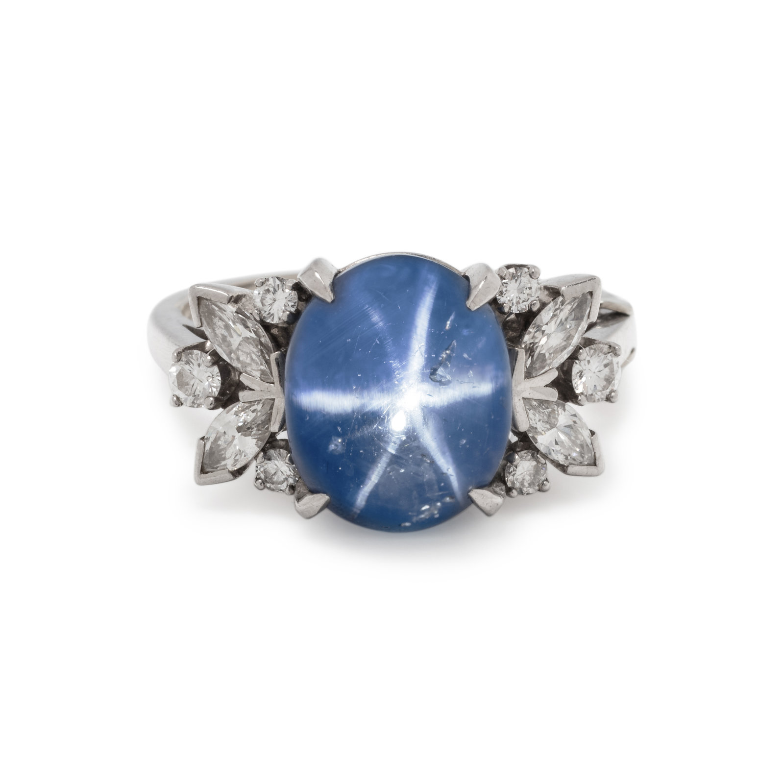 Appraisal: STAR SAPPHIRE AND DIAMOND RING Containing one oval cabochon star