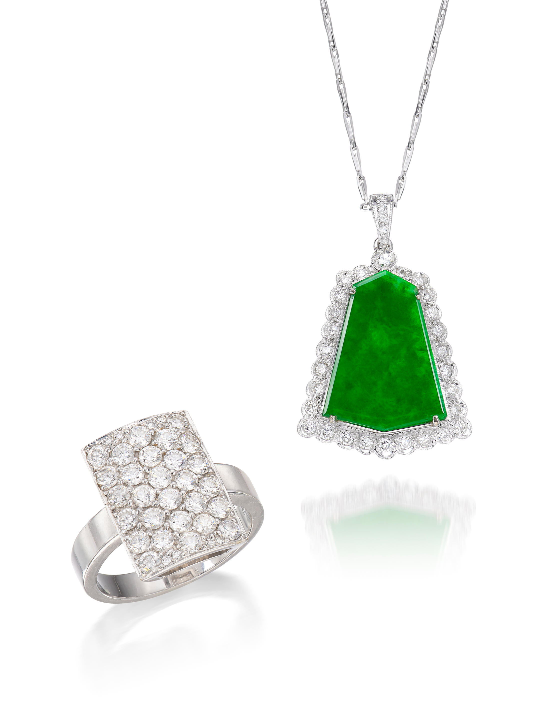 Appraisal: JADEITE AND DIAMOND PENDANT NECKLACE AND A DIAMOND RING Comprising