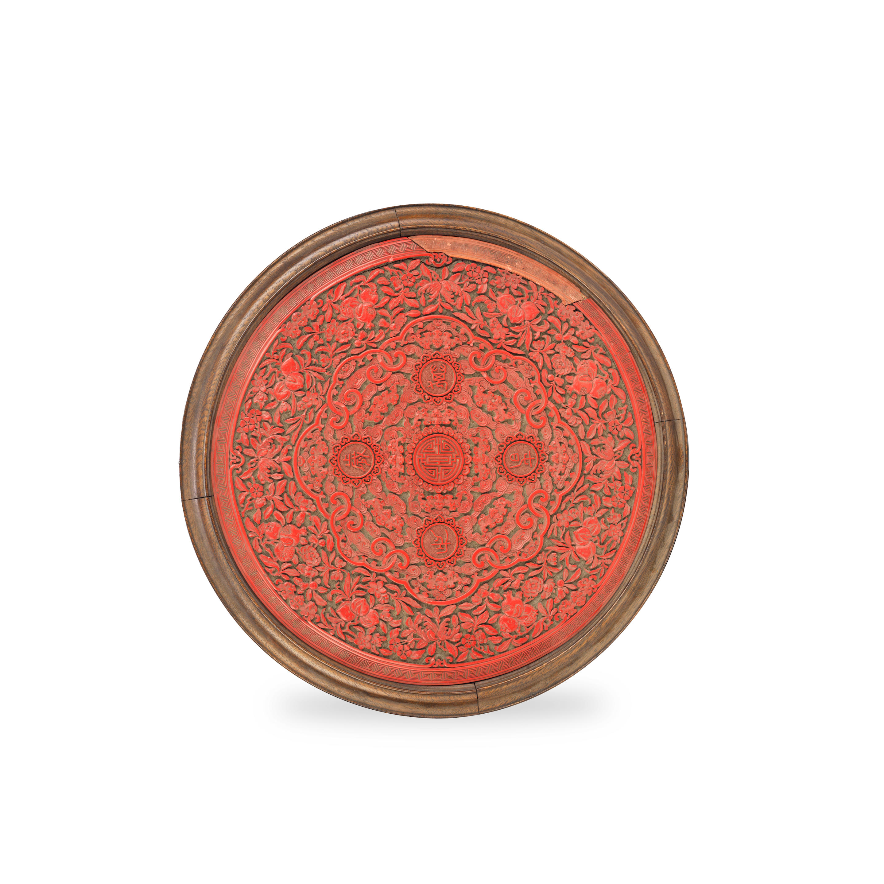 Appraisal: A CARVED CINNABAR LACQUER 'LONGEVITY' PLAQUE Qianlong Of circular form