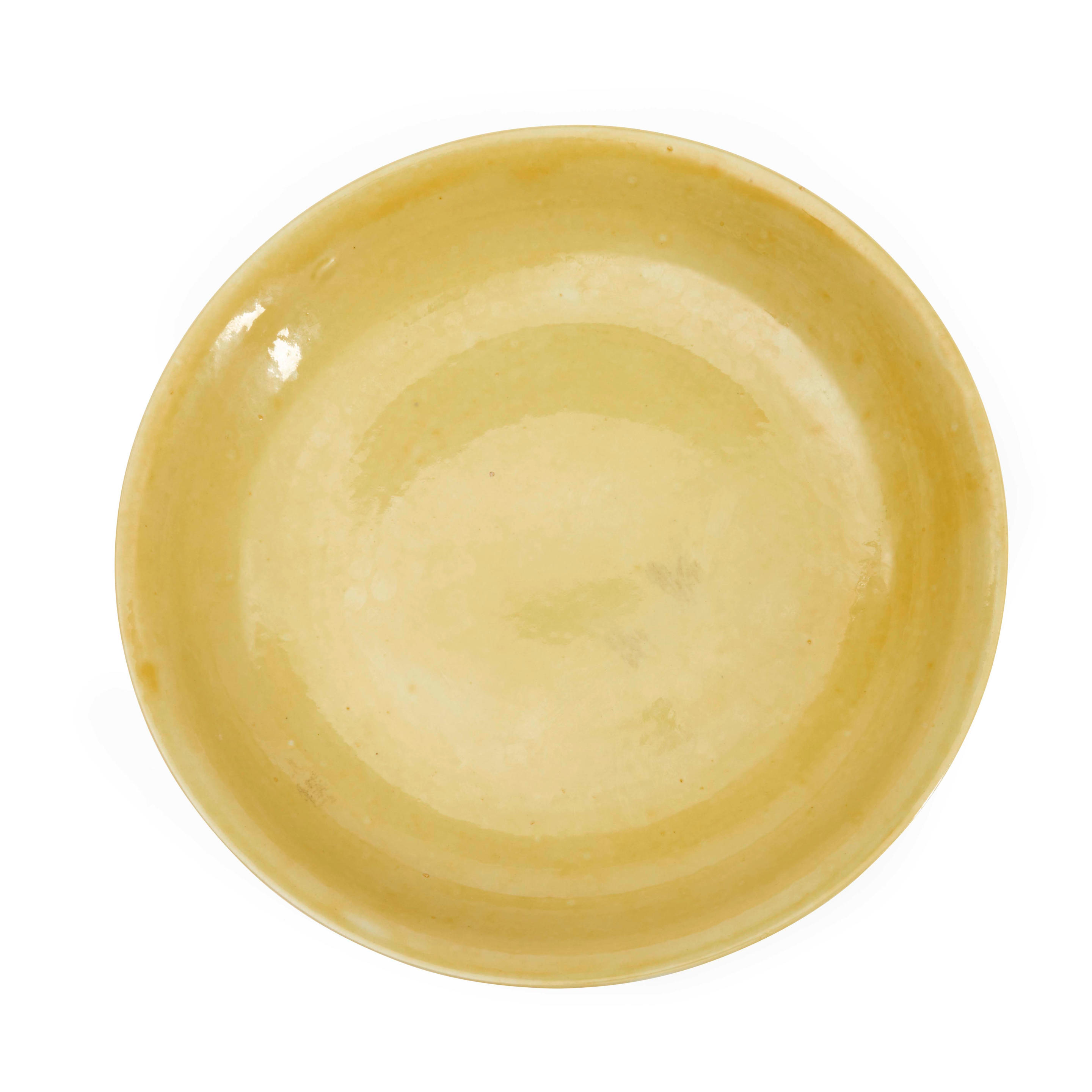 Appraisal: A MONOCHROME YELLOW-GLAZED CHARGER China th century with flared rim