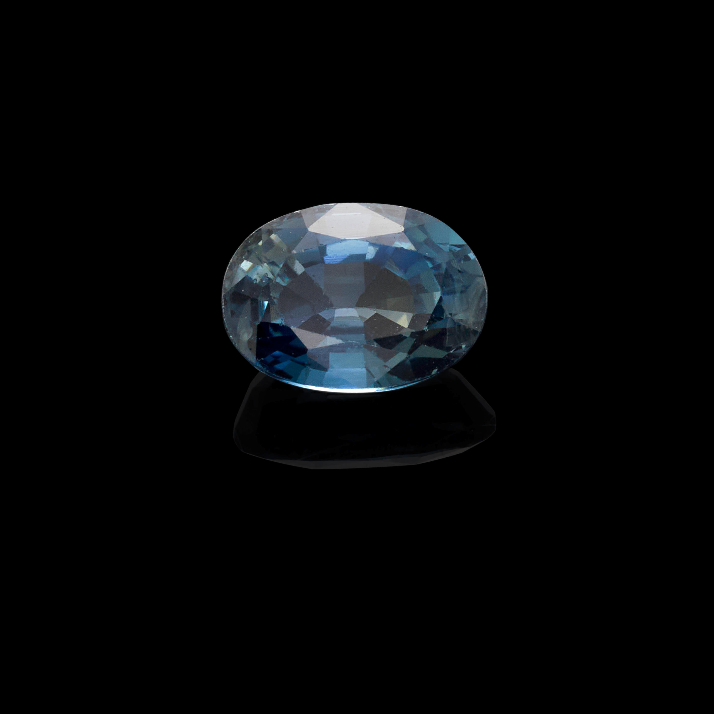 Appraisal: SAPPHIRE Australia An oval-cut sapphire with a greenish-blue hue showing