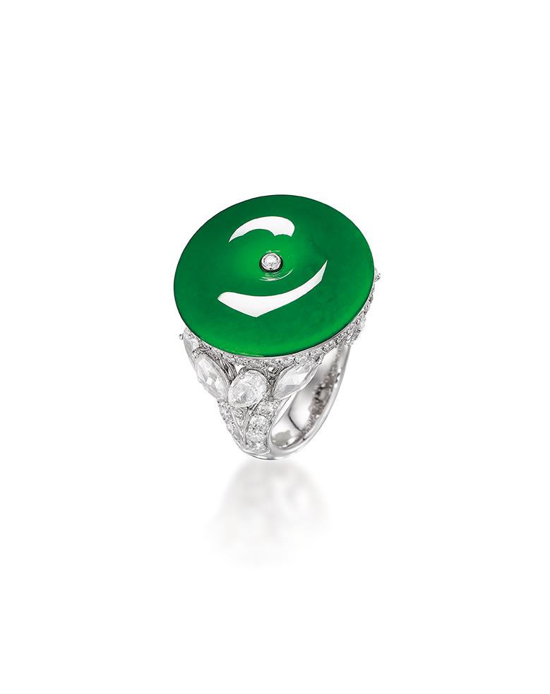 Appraisal: JADEITE AND DIAMOND 'HUAIGU' RING The highly translucent jadeite 'huaigu'