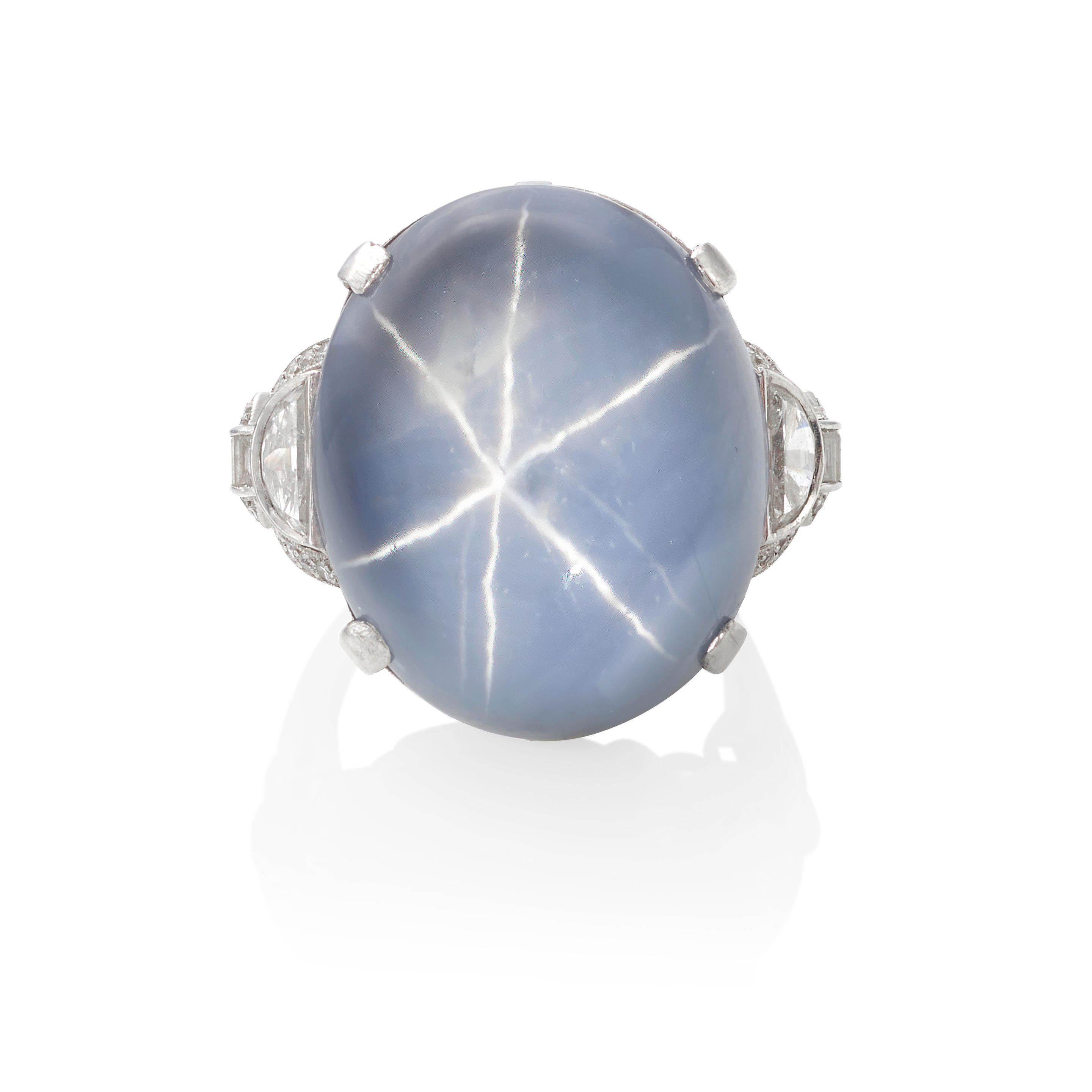 Appraisal: A PLATINUM STAR SAPPHIRE AND DIAMOND RING Highlighting an oval