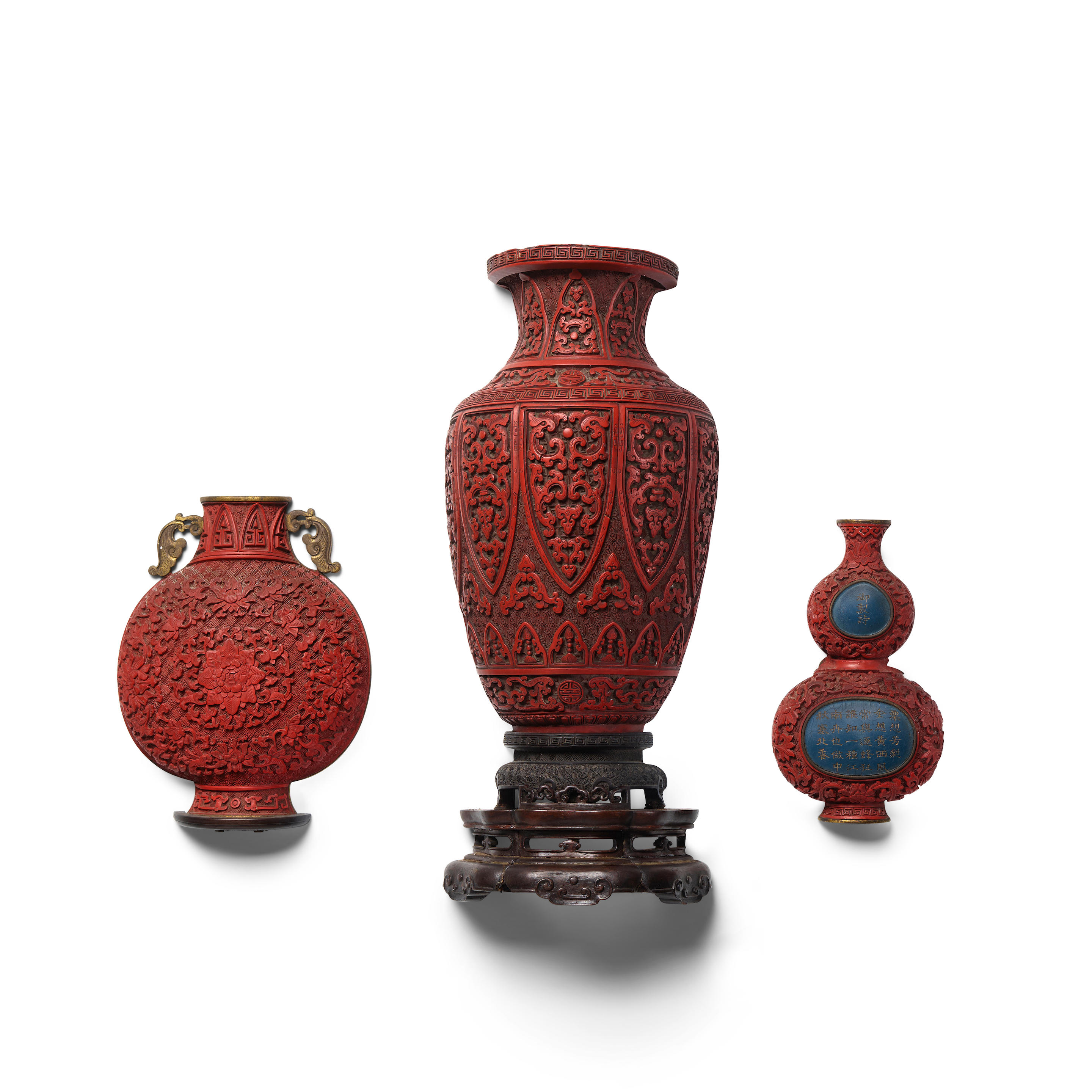 Appraisal: A GROUP OF THREE CARVED CINNABAR LACQUER WALL VASES Late