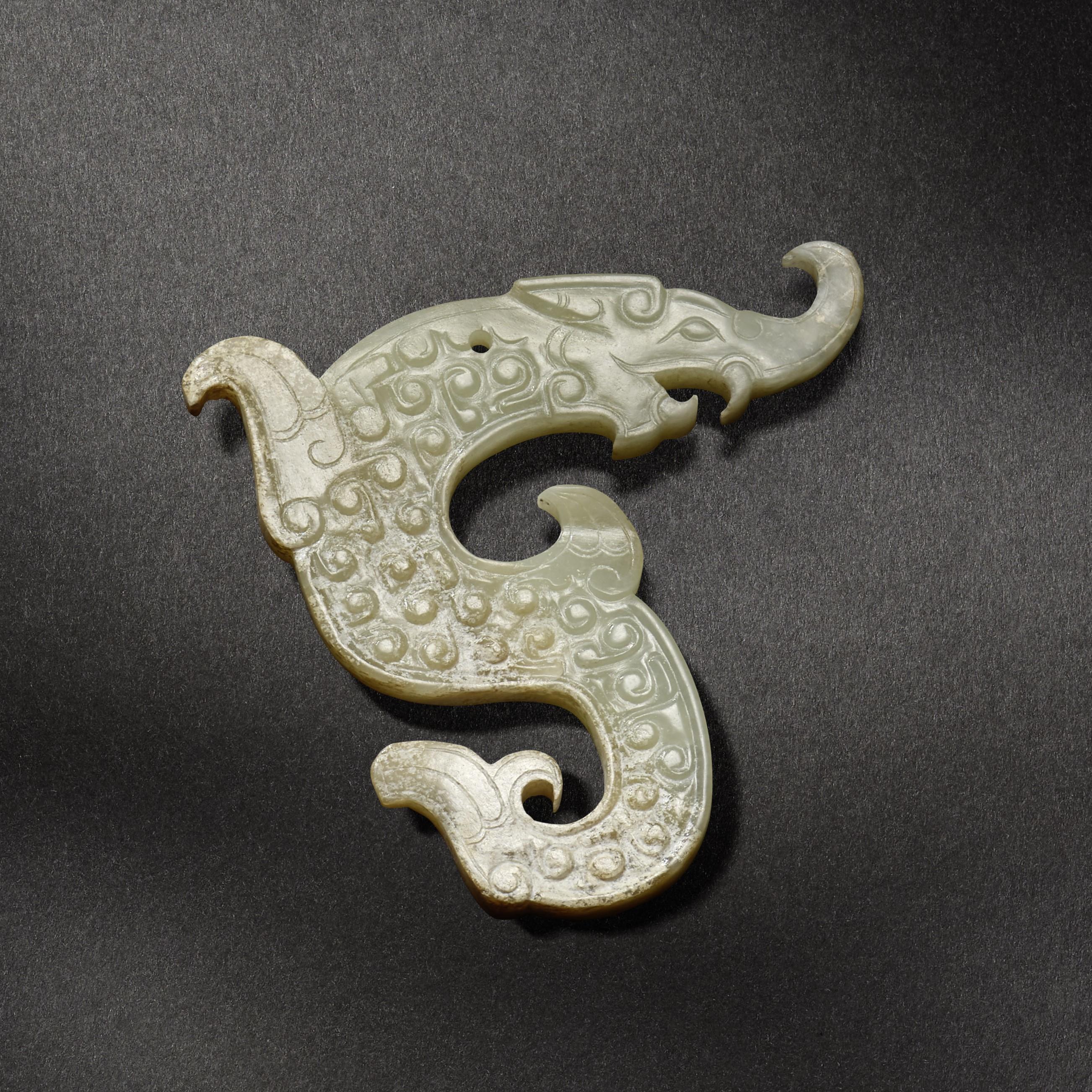 Appraisal: A WHITE JADE 'DRAGON' PLAQUE Warring States Period Carved in