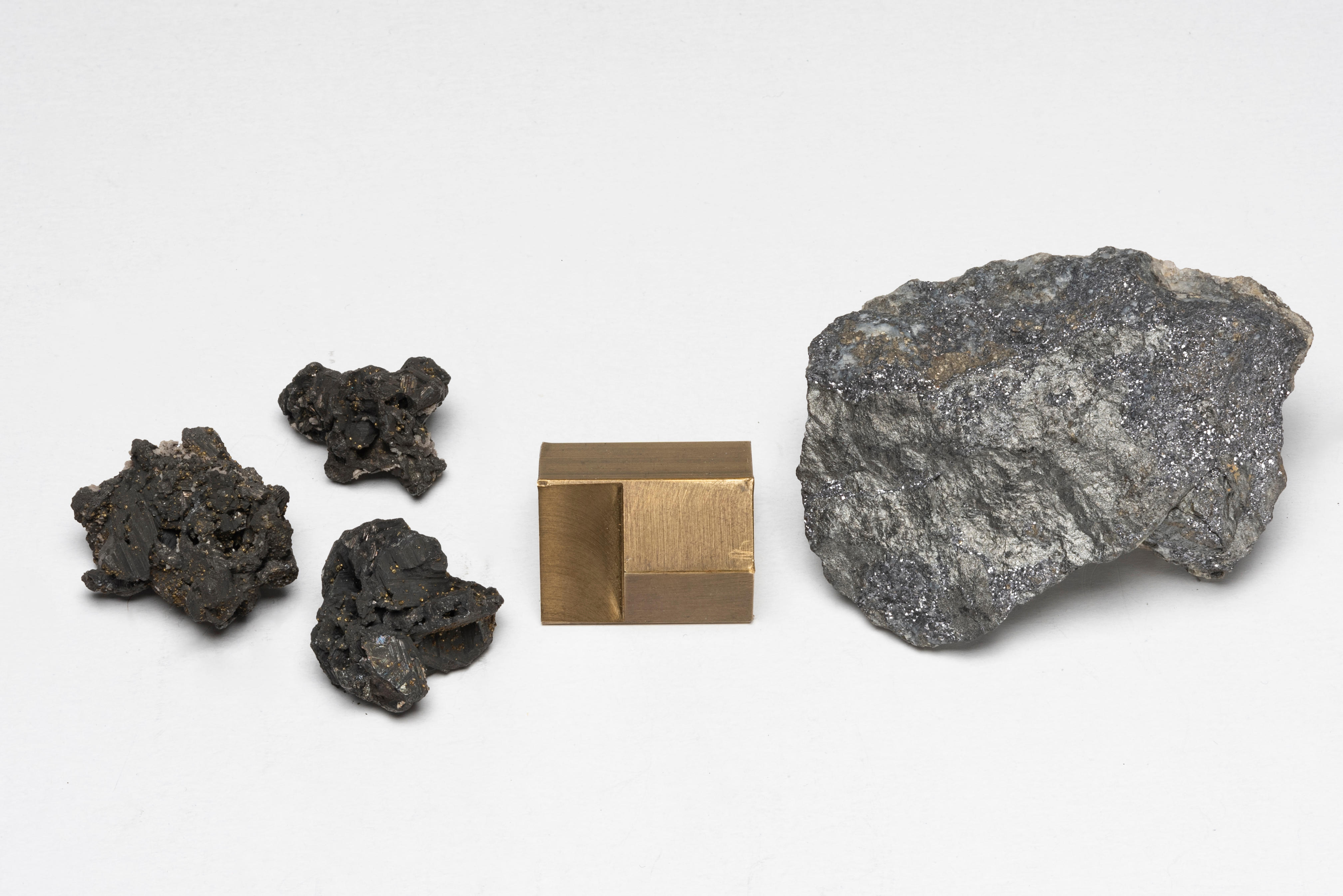 Appraisal: TETRAHEDRITE AND THREE SMALL BOURNONITE SPECIMENS Tetraedrite specimen showing lustrous