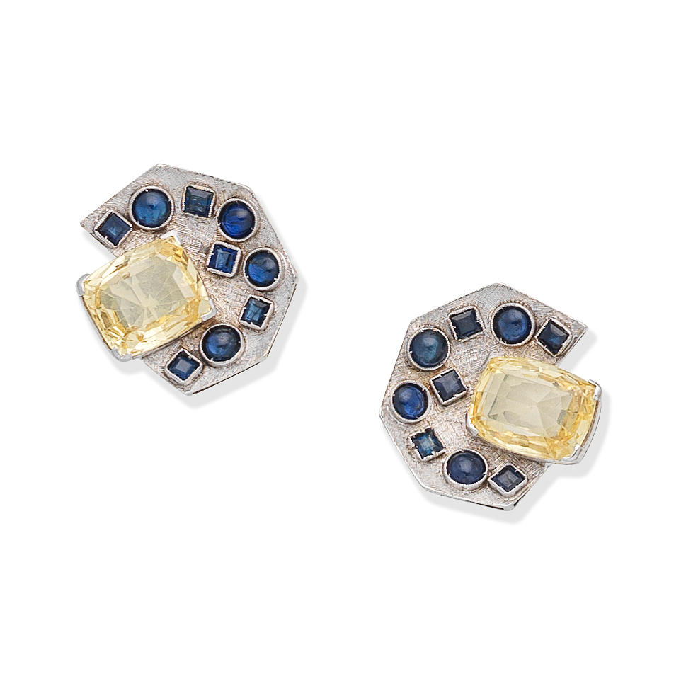 Appraisal: SAPPHIRE AND FANCY COLOURED SAPPHIRE EARCLIPS Each centrally set with