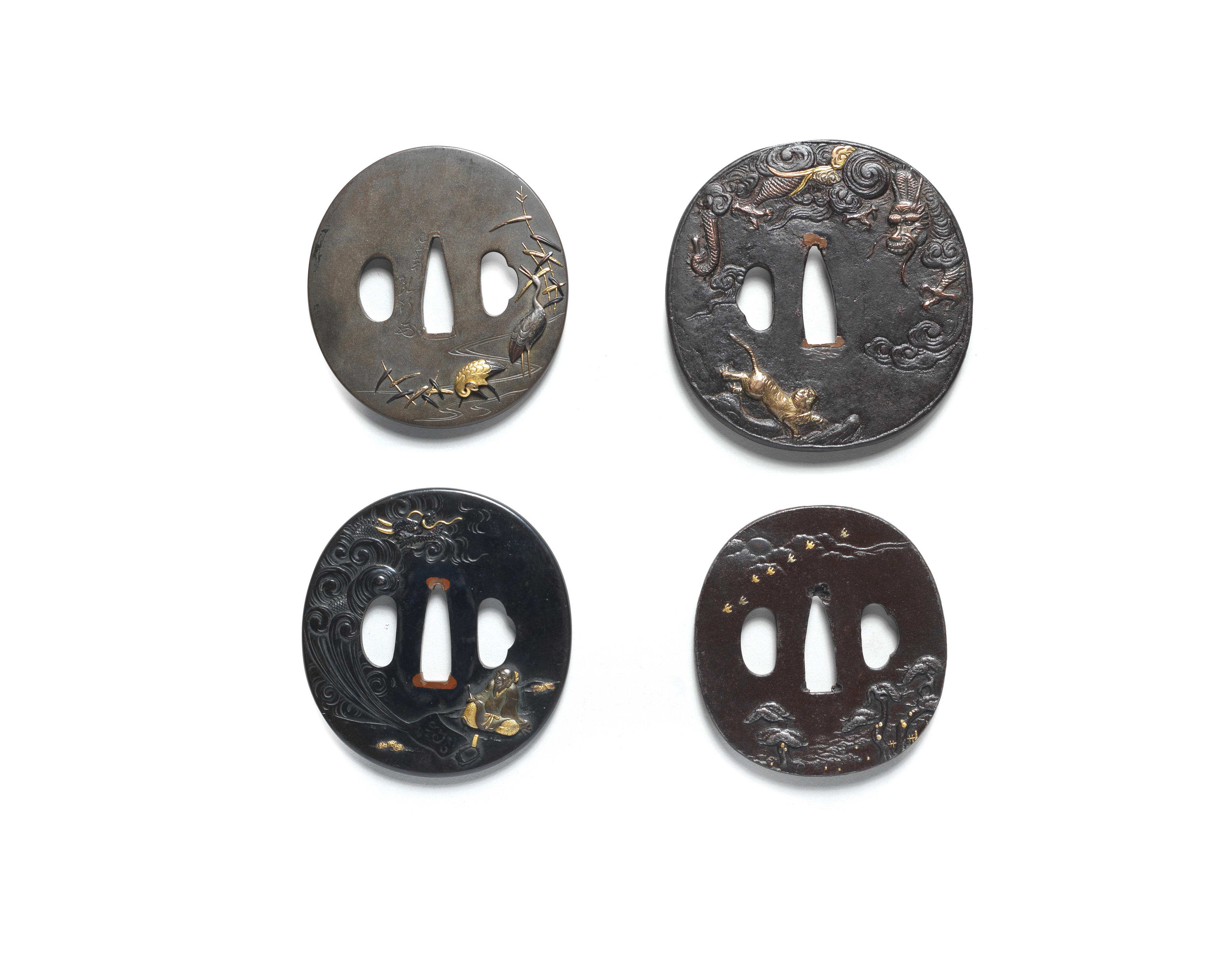 Appraisal: FOUR TSUBA HAND GUARDS Edo period - th to th