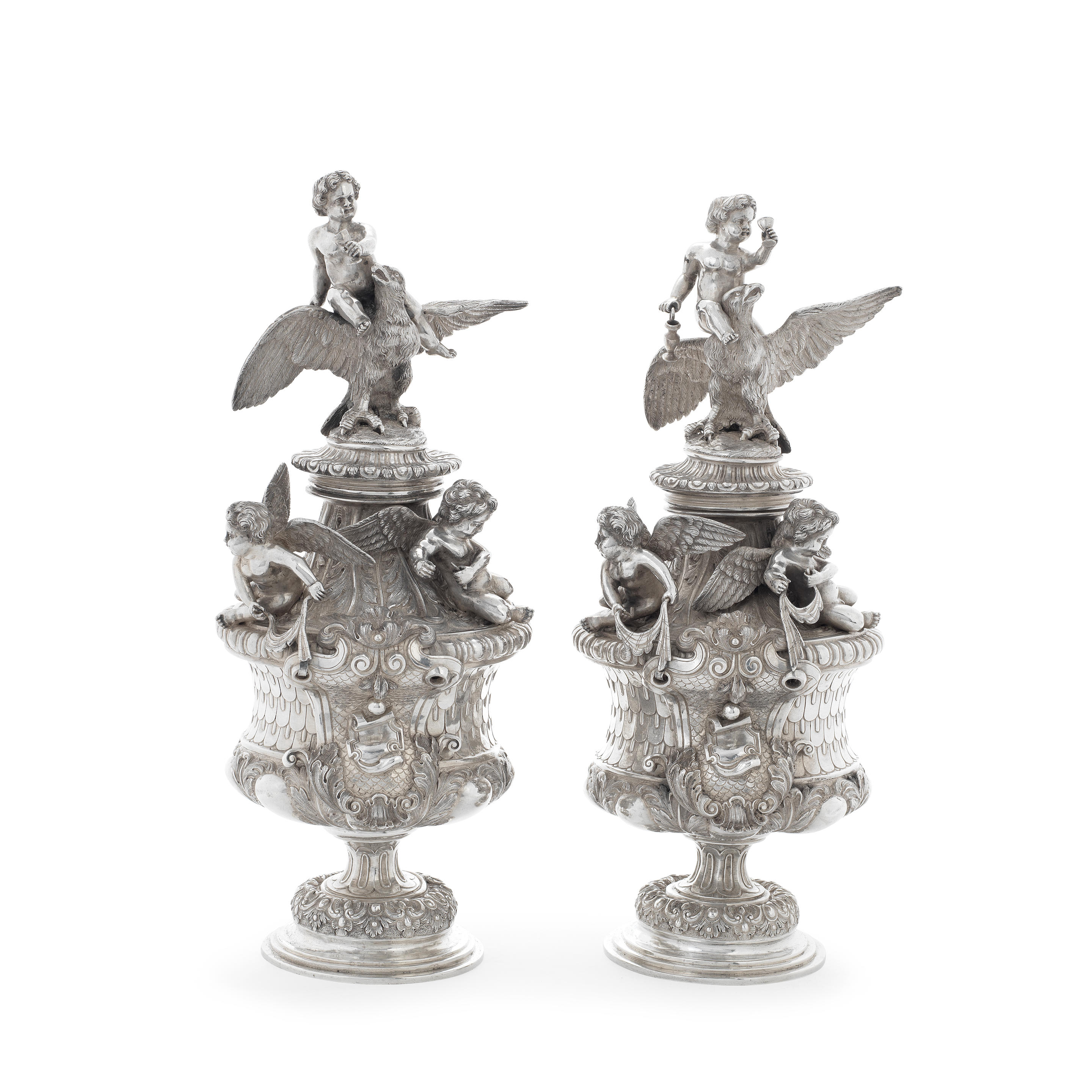 Appraisal: A MATCHING PAIR OF TH CENTURY CONTINENTAL SILVER COVERED URNS