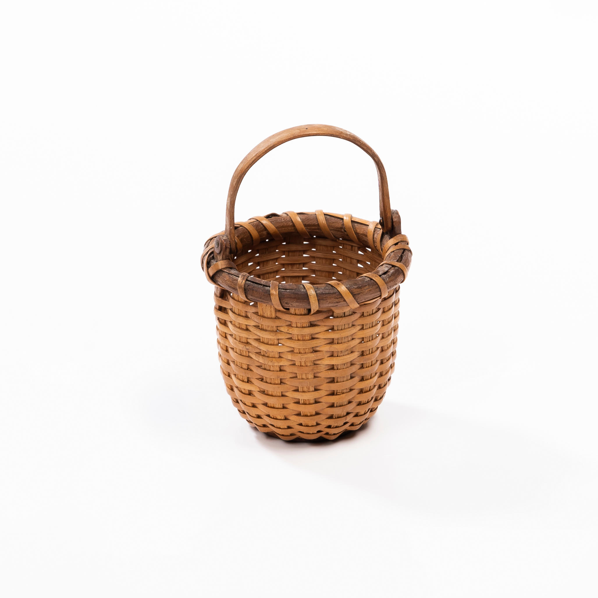 Appraisal: MINIATURE LIGHTSHIP BASKET Nantucket Massachusetts c Cane-weave basket with bentwood