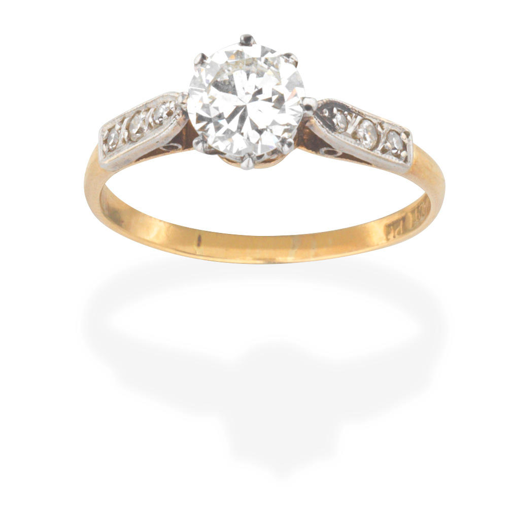 Appraisal: DIAMOND SINGLE-STONE RING The brilliant-cut diamond between single-cut diamond shoulders