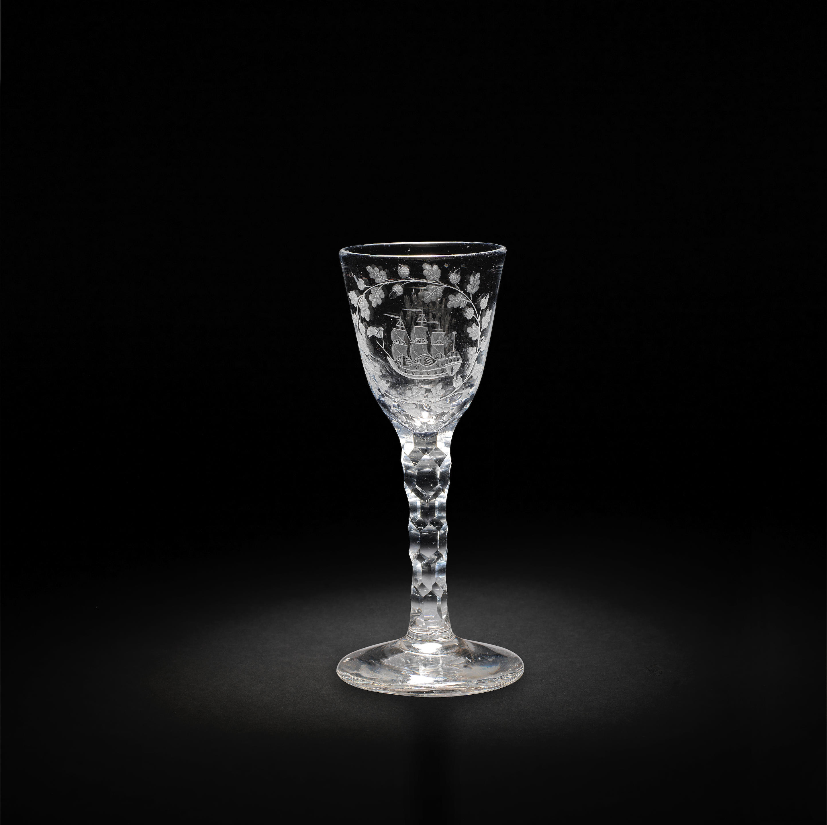 Appraisal: A RARE FACET-STEM WINE GLASS CIRCA The round funnel bowl