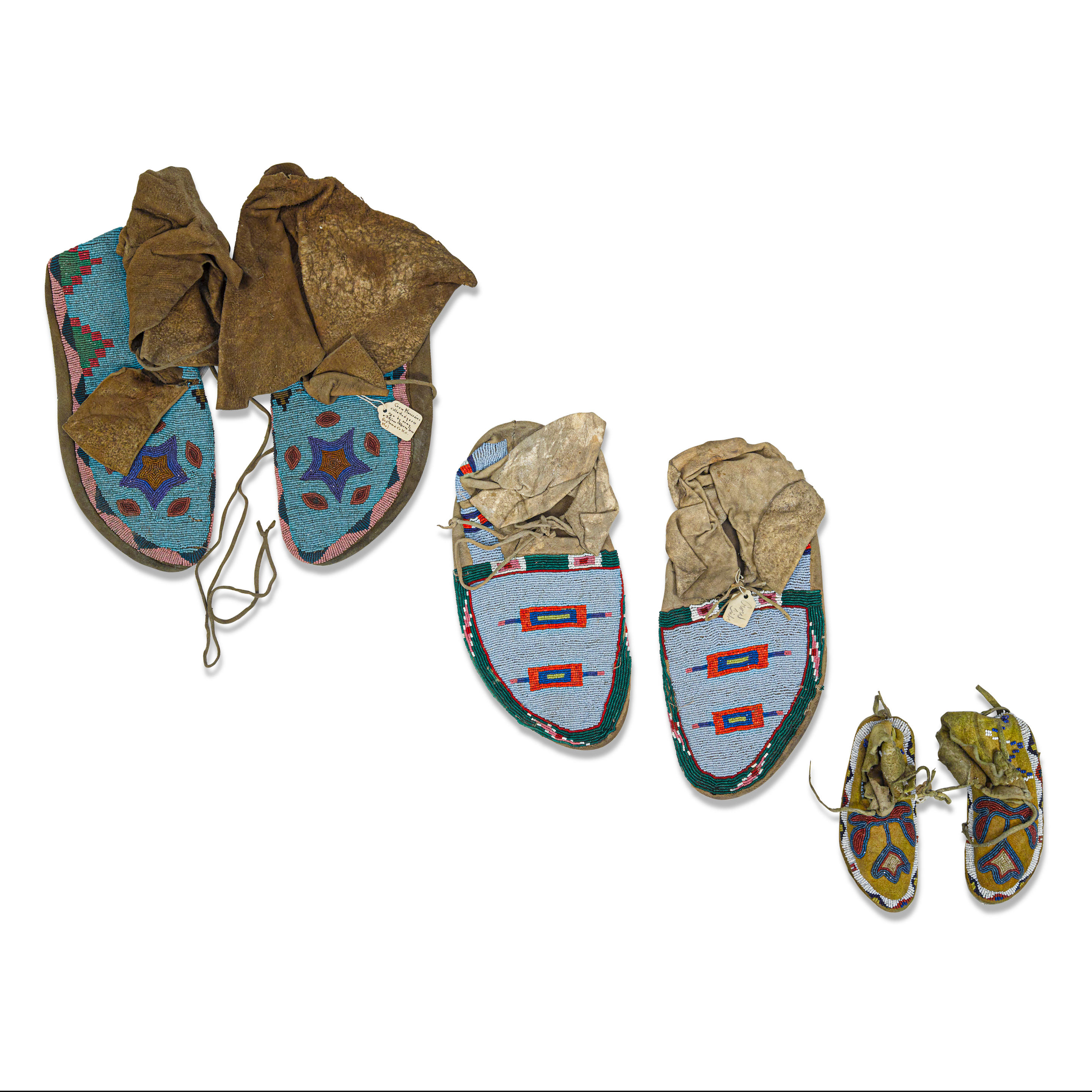 Appraisal: THREE PAIRS OF APS ALOOKE CROW BEADED MOCCASINS The two