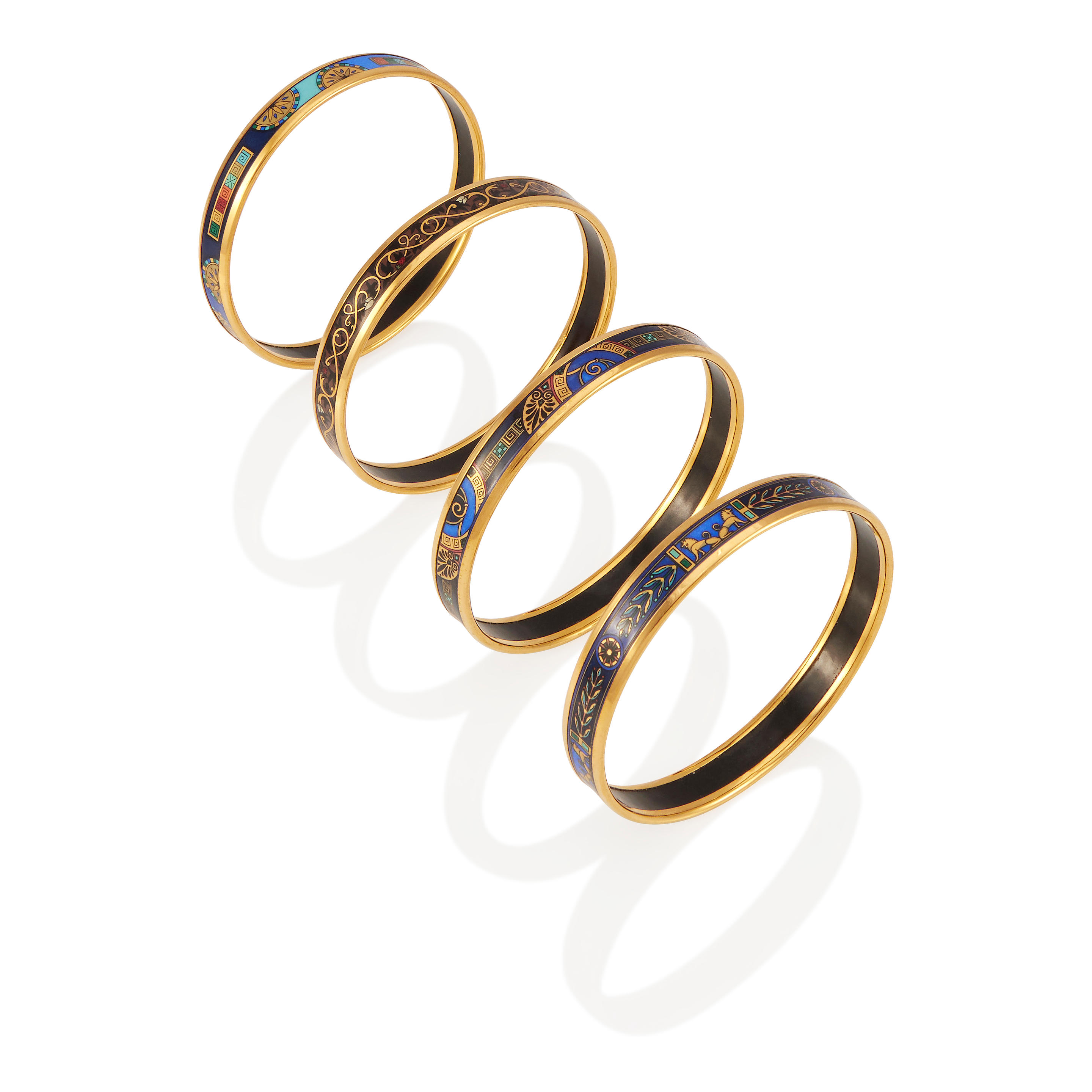 Appraisal: MICHAELA FREY WIEN FOUR PRINTED ENAMEL BANGLE BRACELETS Yellow gold