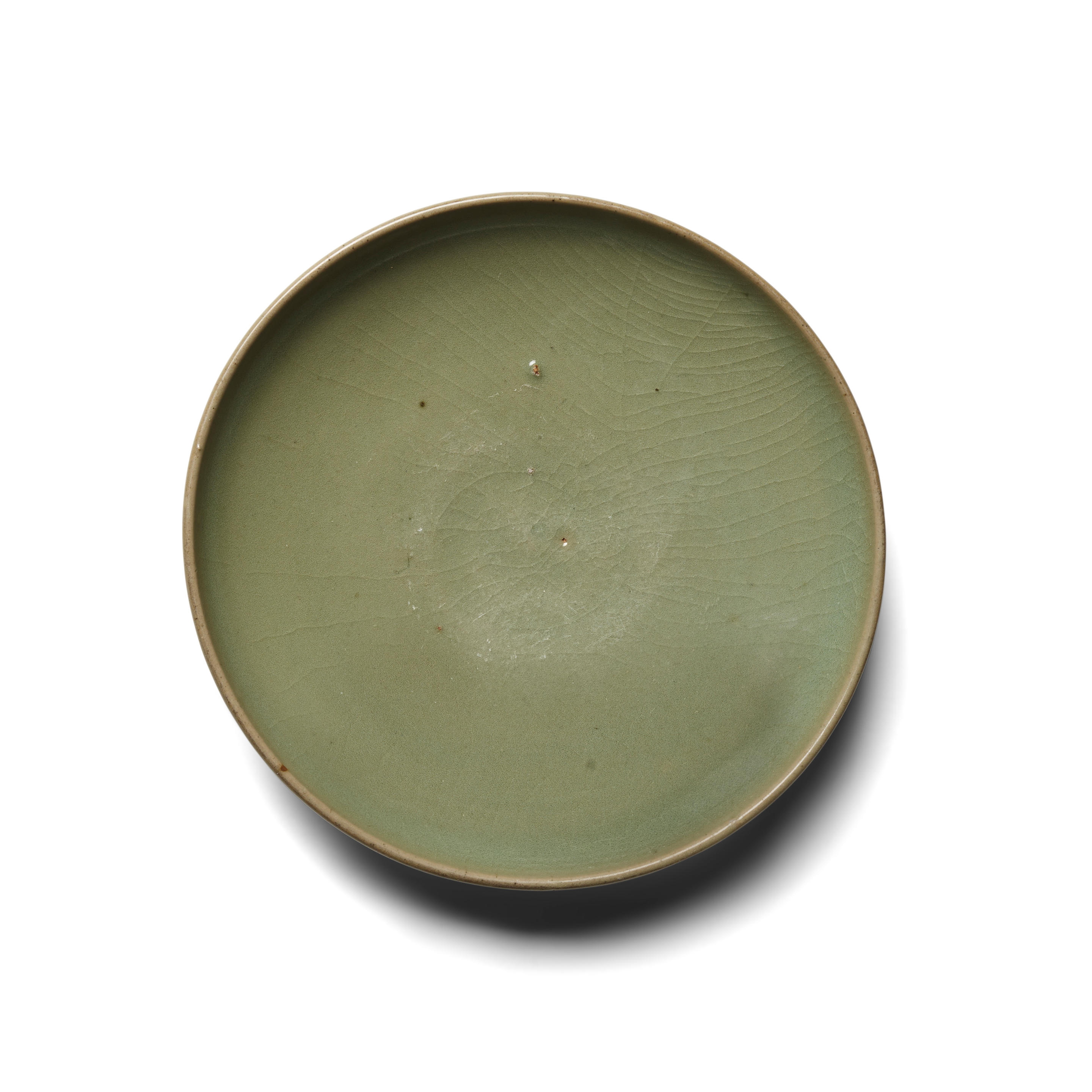 Appraisal: A CELADON-GLAZED DISH th th century Carefully potted with a