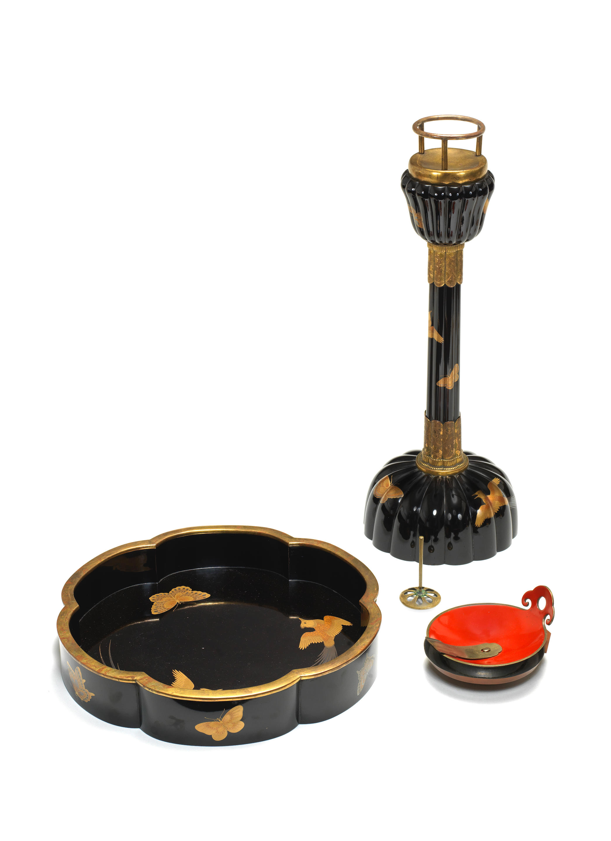 Appraisal: A BLACK-LACQUER MATCHING CANDLESTICK AND TRAY WITH AN OIL DISH