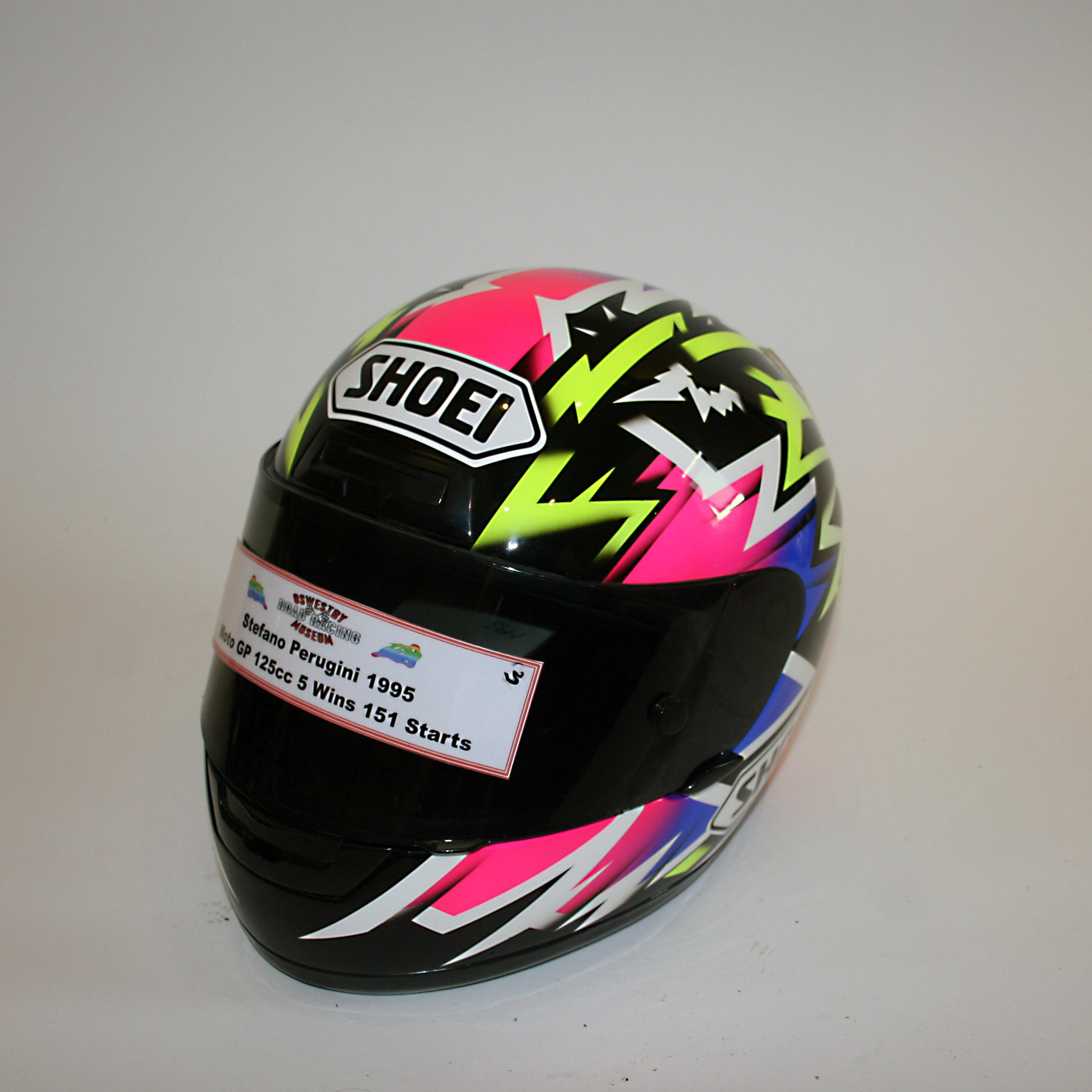 Appraisal: STEFANO PERUGINI A FULL-FACE HELMET BY SHOEI used and worn