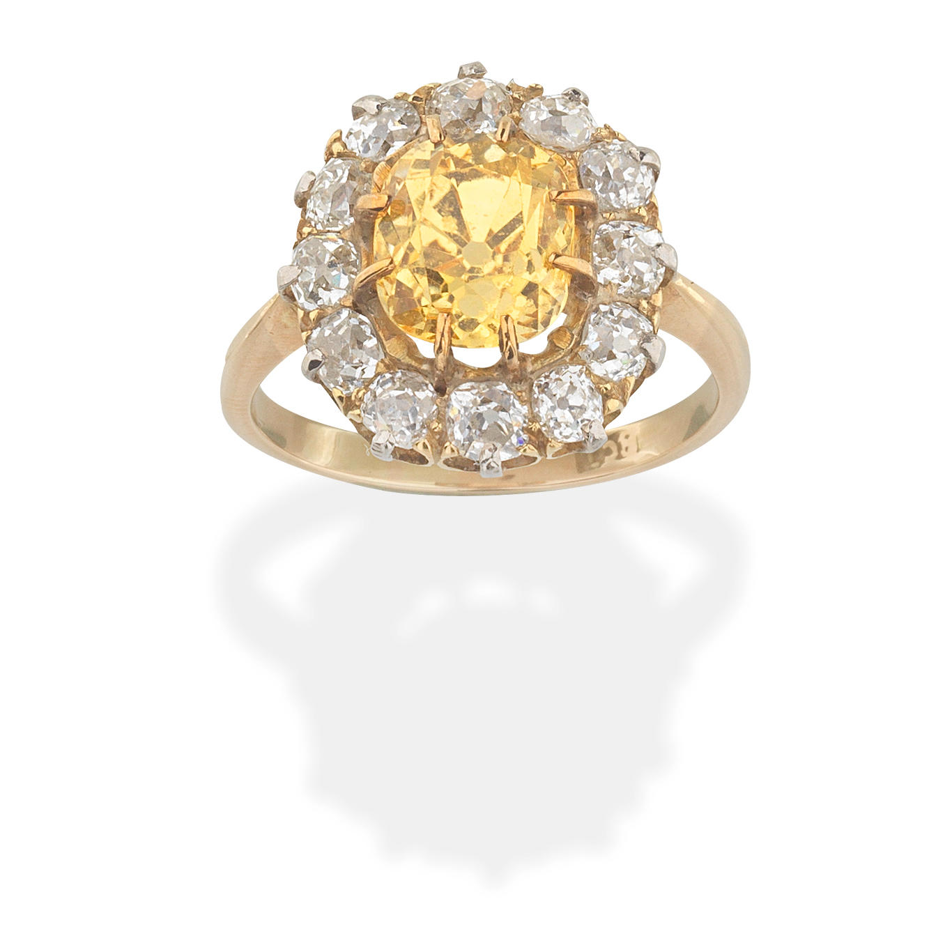 Appraisal: YELLOW SAPPHIRE AND DIAMOND RING Cushion-shaped yellow sapphire and cushion-shaped