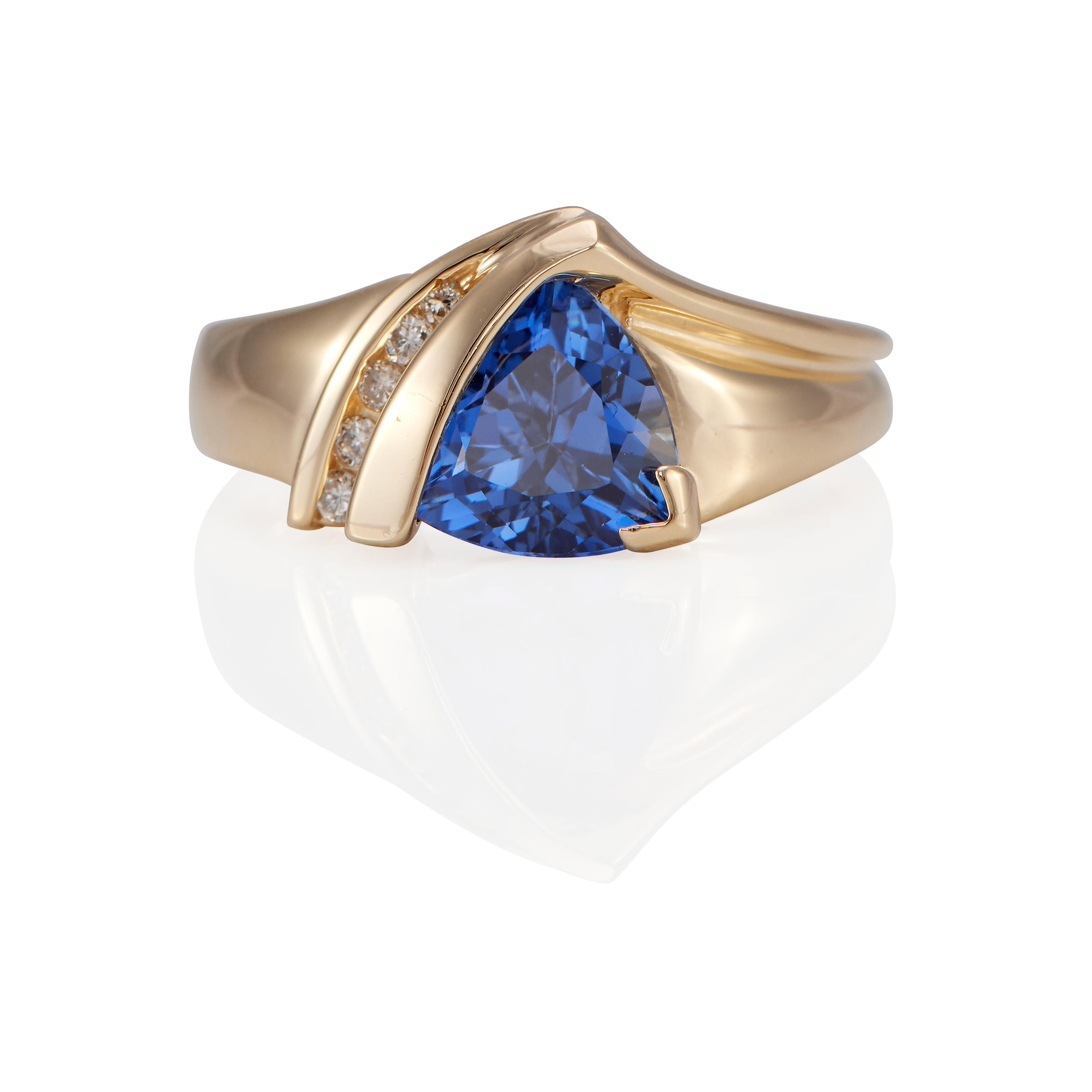 Appraisal: A K GOLD TANZANITE AND DIAMOND RING k yellow gold