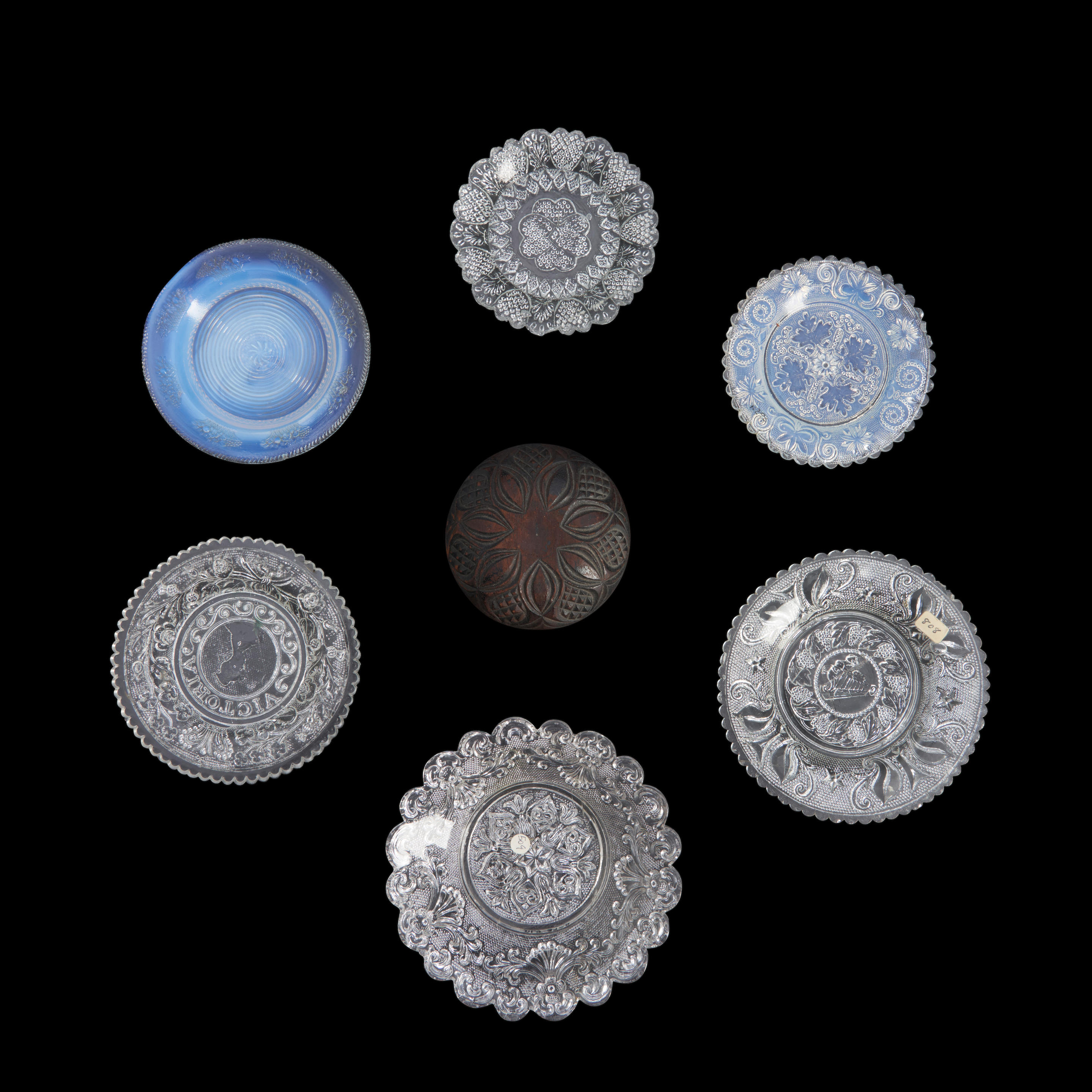 Appraisal: SIX PRESSED GLASS CUP PLATES AND A WOODEN PATTERN MOLD