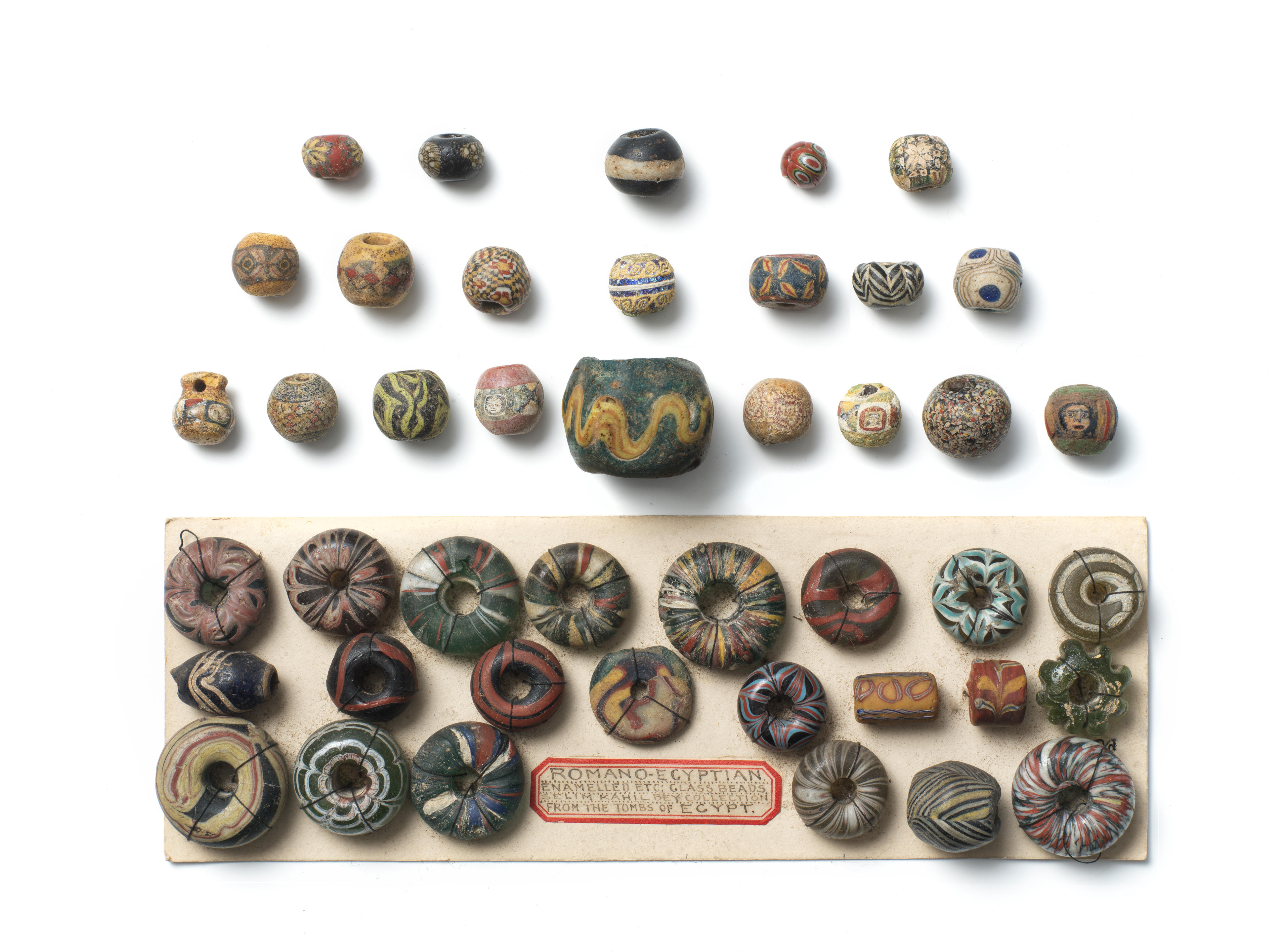 Appraisal: A GROUP OF ROMAN AND LATER GLASS BEADS A group