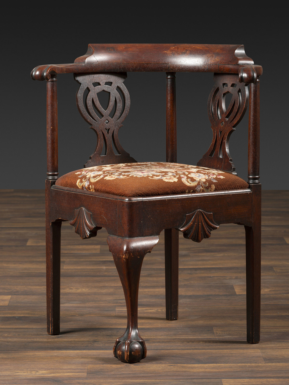 Appraisal: A Chippendale Shell-Carved Mahogany Knuckle-Arm Claw-and-Ball Foot Corner Chair Likely