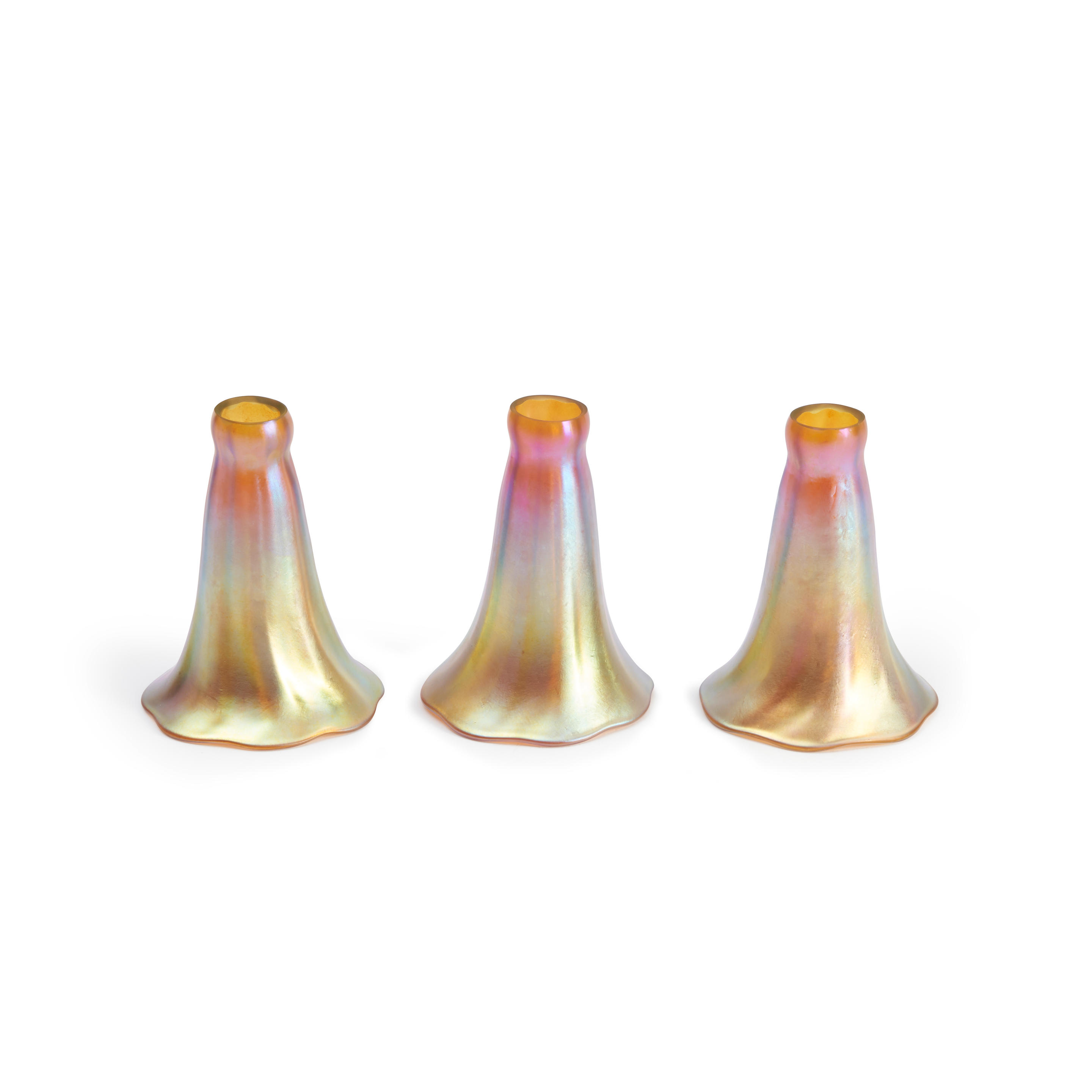 Appraisal: THREE TIFFANY-STYLE IRIDESCENT GOLD LAMP SHADES unmarked ht fitter rim