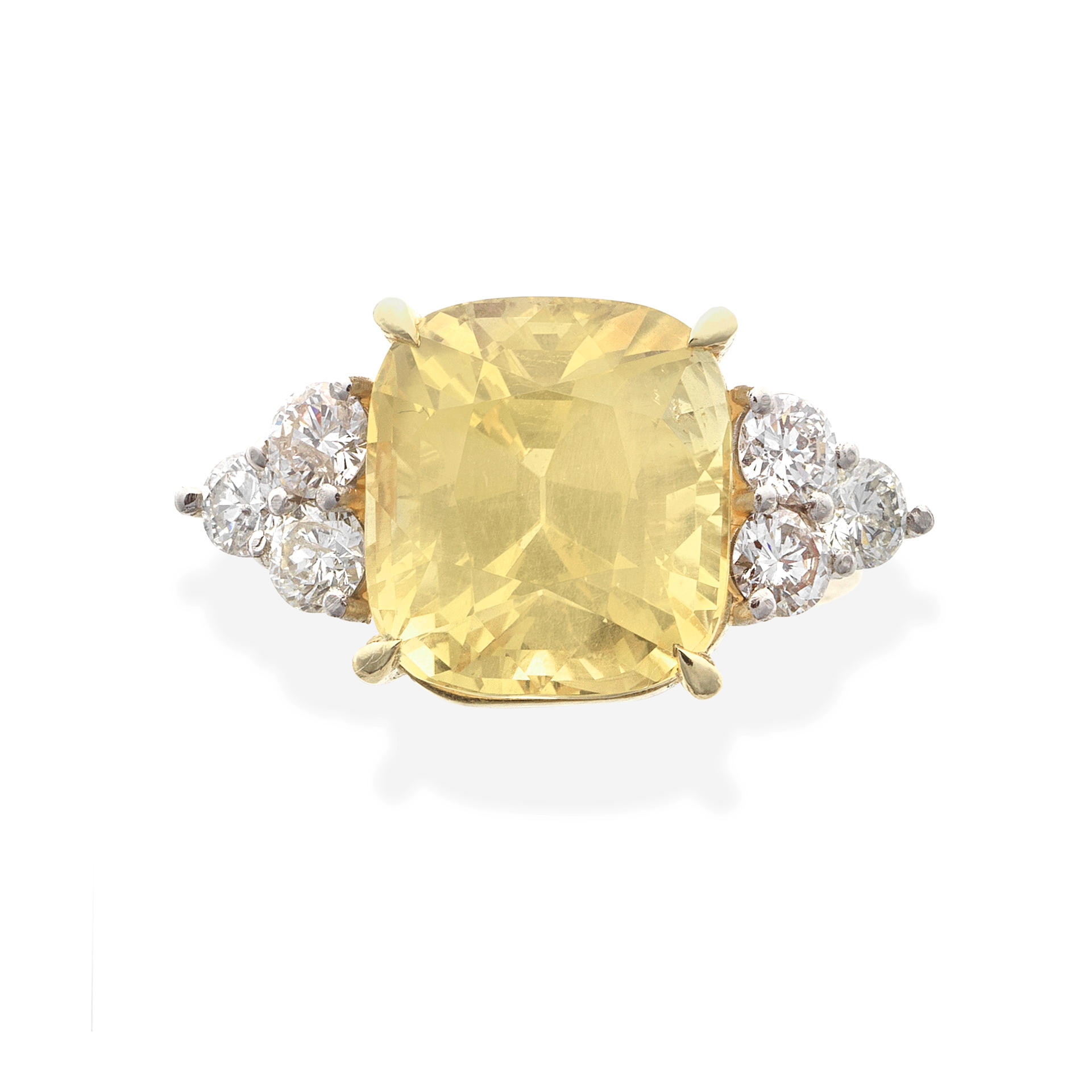 Appraisal: YELLOW SAPPHIRE AND DIAMOND RING The cushion-shaped sapphire weighing carats