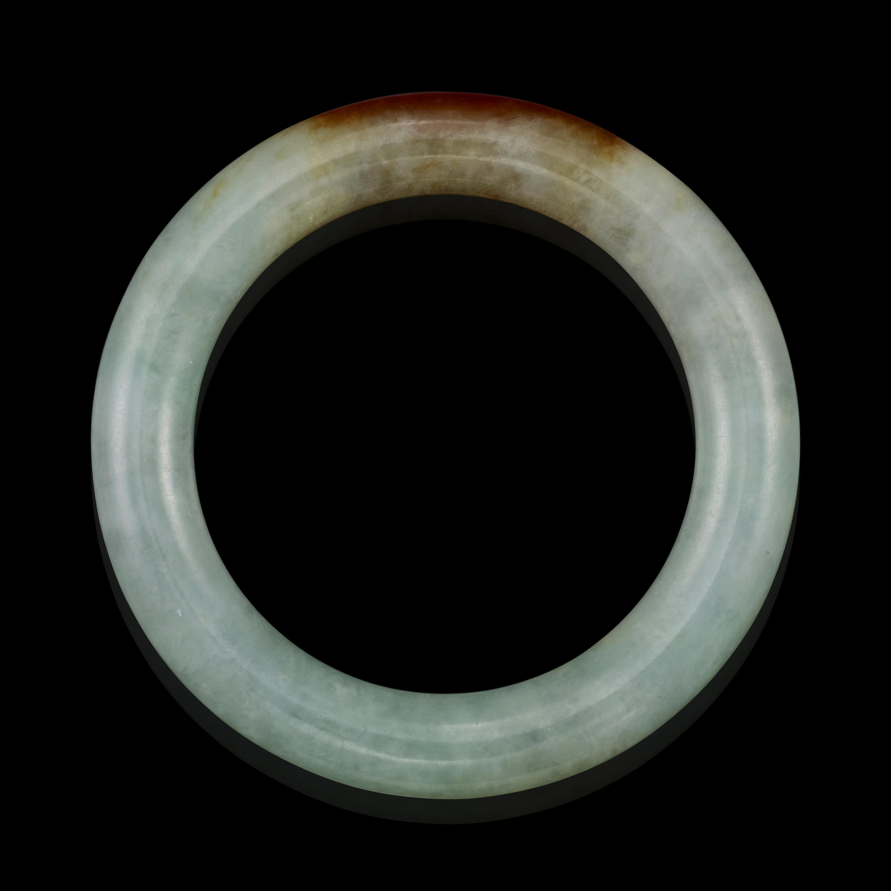 Appraisal: JADEITE JADE BANGLE BRACELET A jadeite jade bangle with natural