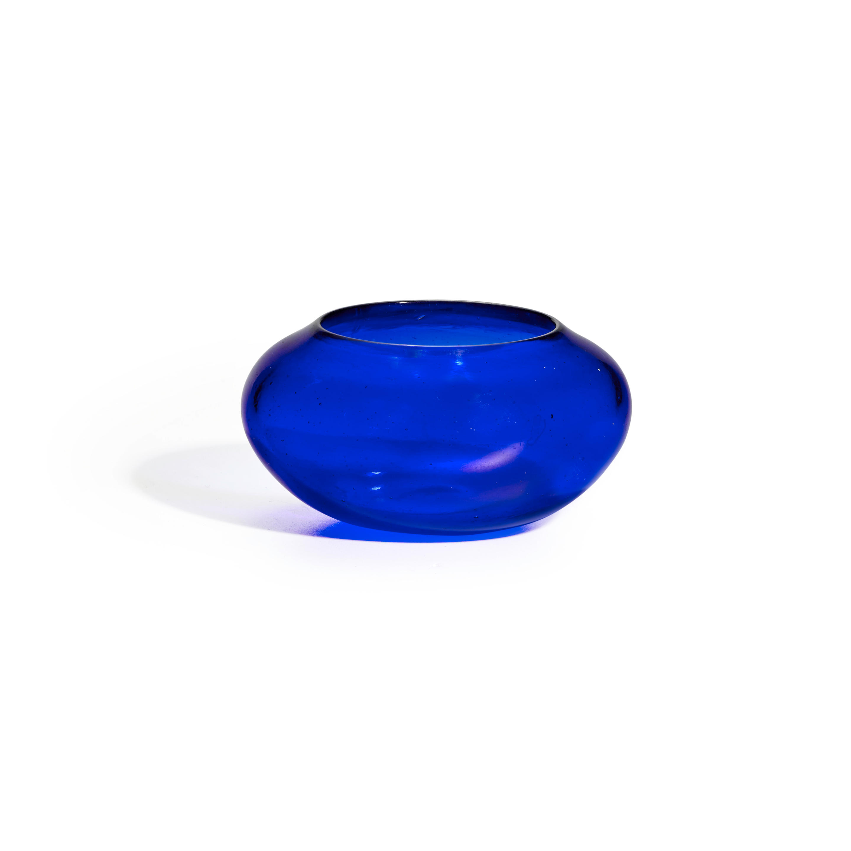 Appraisal: AN ELEGANT TRANSPARENT DEEP BLUE GLASS COMPRESSED-FORM JARLET OR BOWL