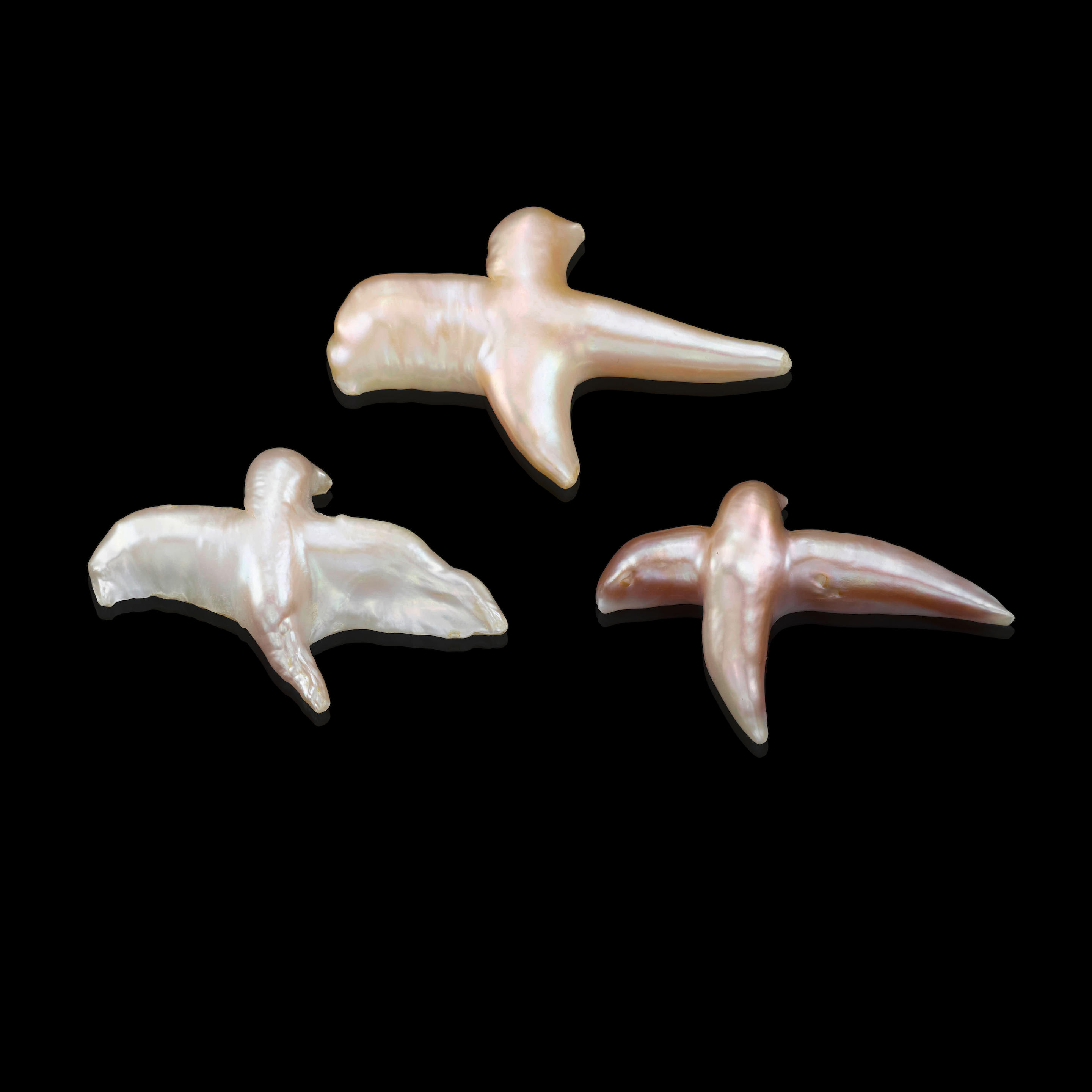 Appraisal: THREE BIRD-FORM FRESHWATER CULTURED PEARLS The first a white bird-form