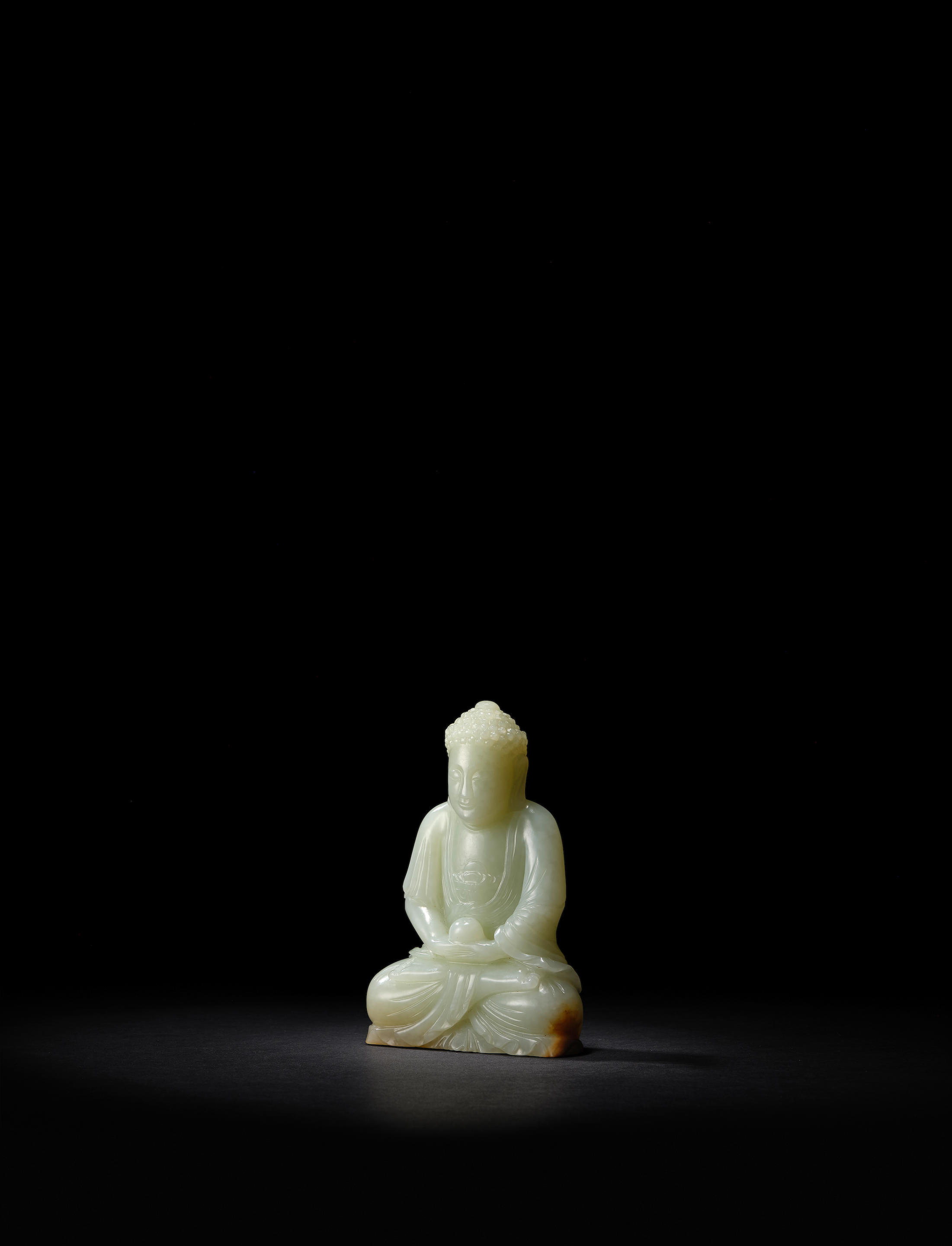 Appraisal: A PALE GREEN JADE FIGURE OF BUDDHA th th century