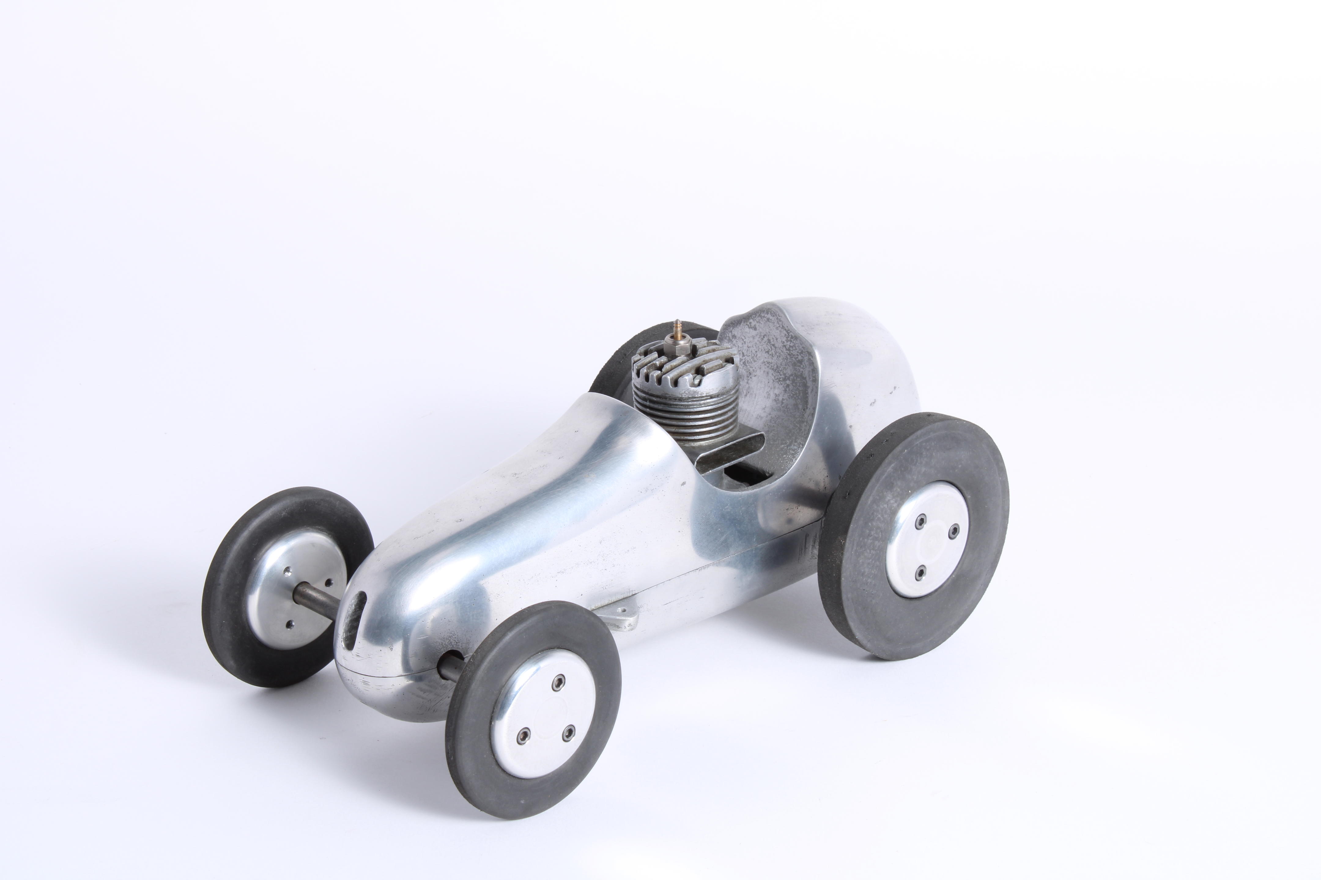 Appraisal: A MCCOY TETHER RACING CAR AMERICAN CIRCA S Polished alloy