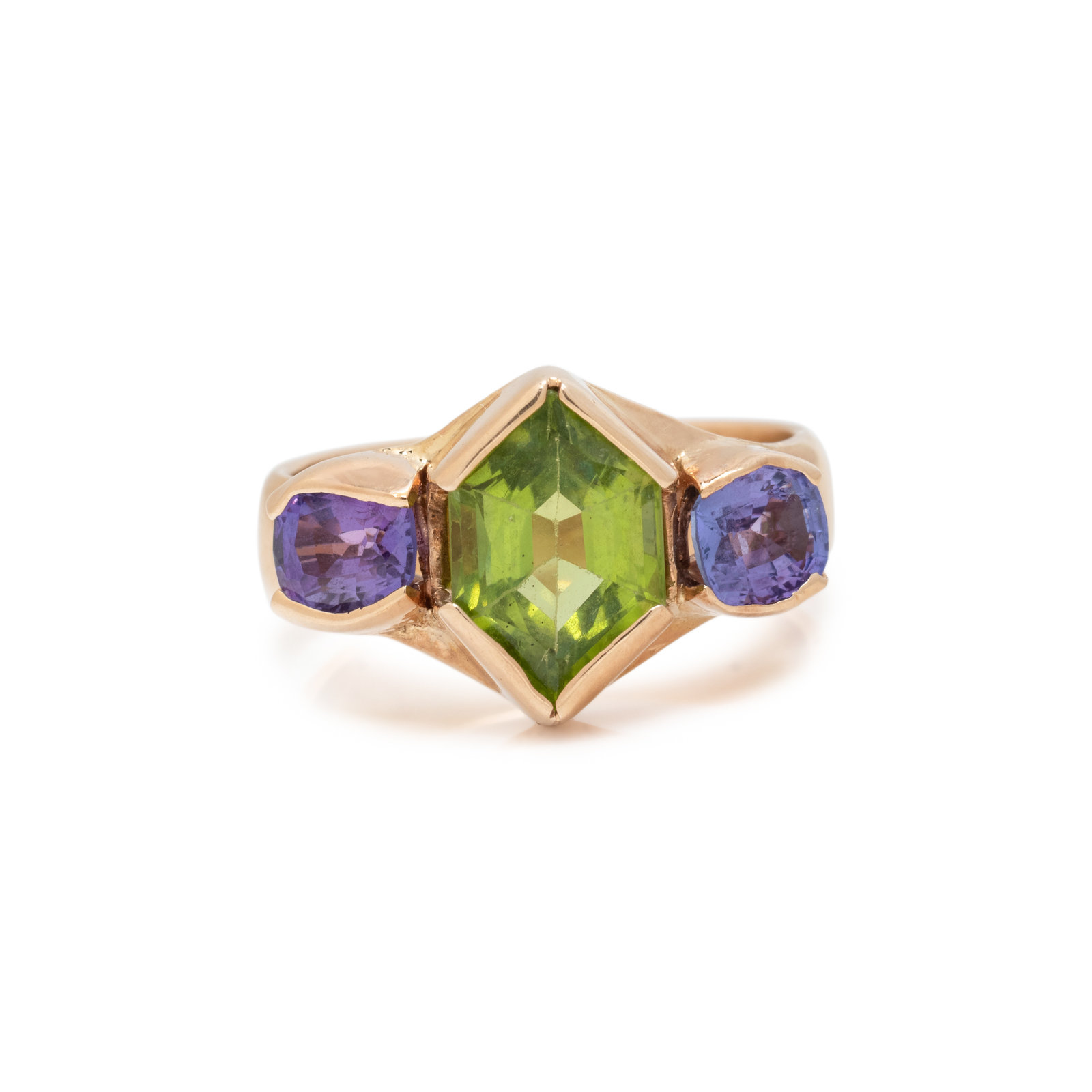 Appraisal: YELLOW GOLD PERIDOT AND TANZANITE RING Containing one hexagonal shaped