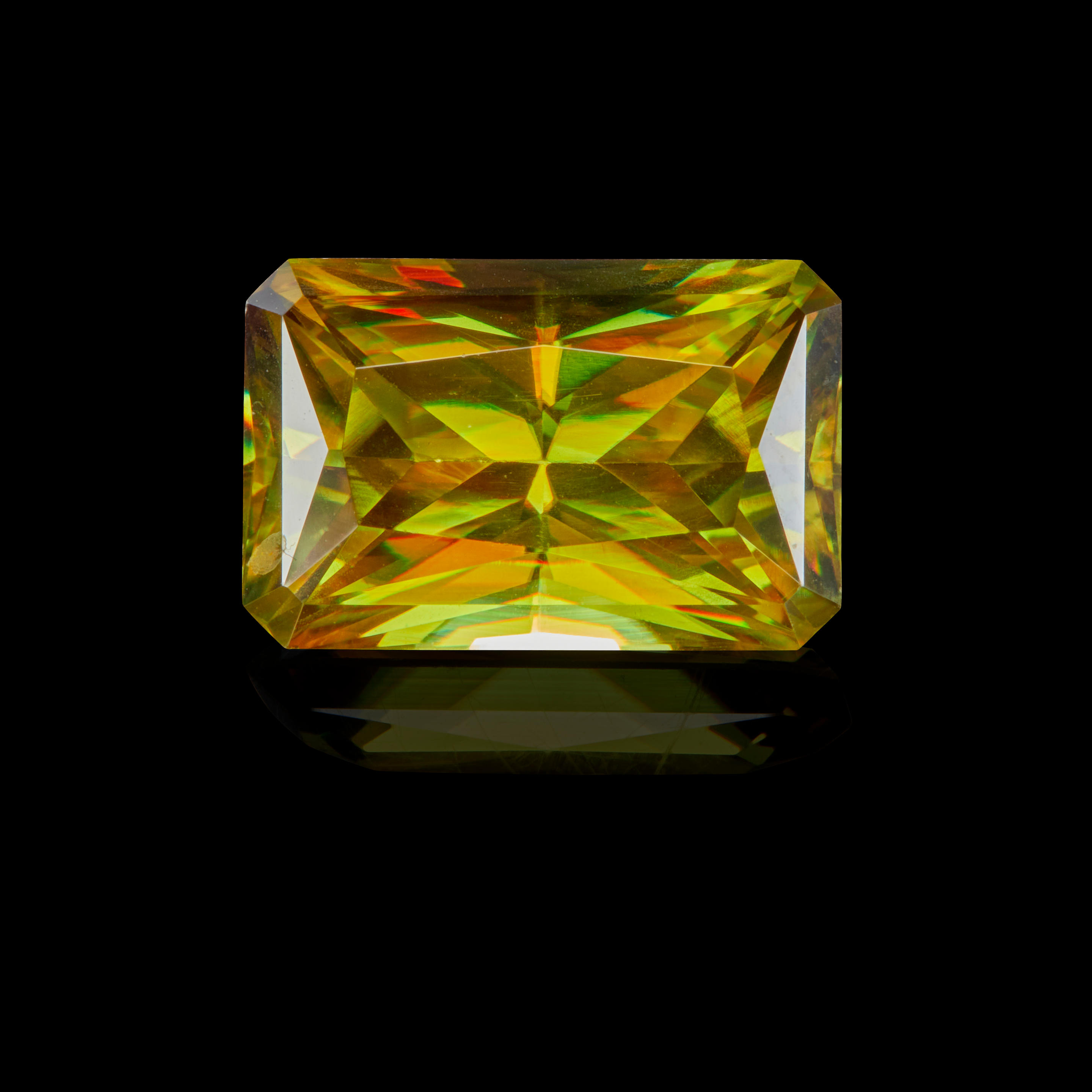 Appraisal: SPHENE Faceted as a radiant-cut stone with simple facets which