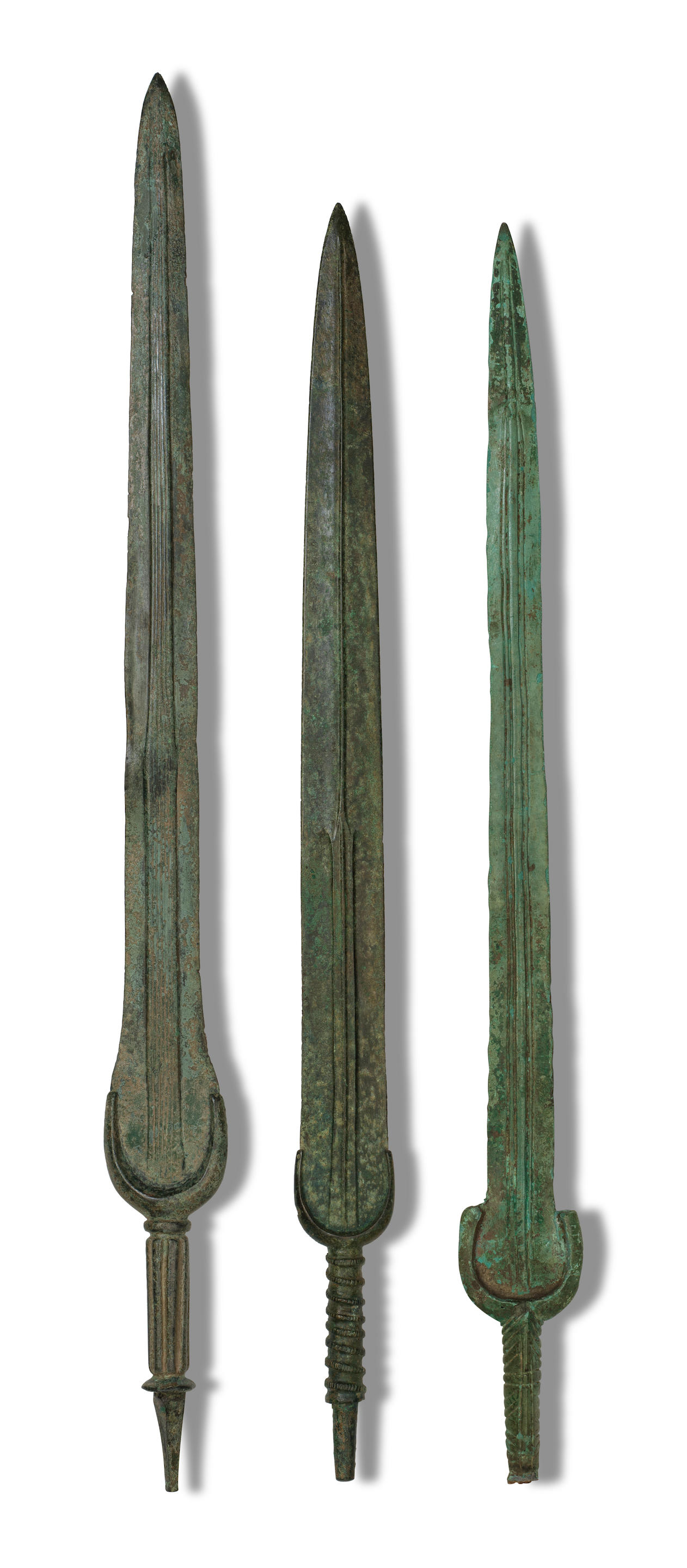 Appraisal: THREE LURISTAN BRONZE SWORDS Three Luristan bronze swords Circa th