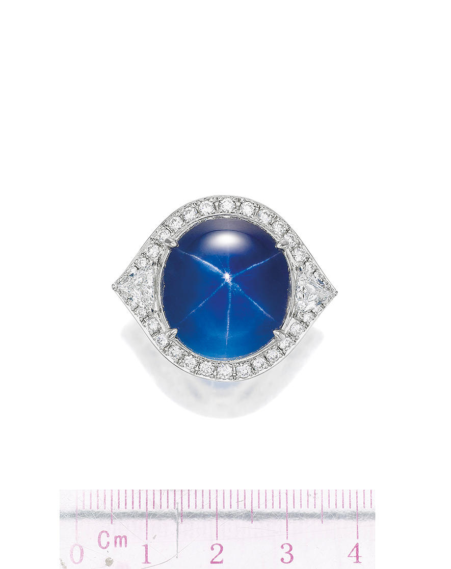 Appraisal: STAR SAPPHIRE AND DIAMOND RING The cabochon star sapphire weighing