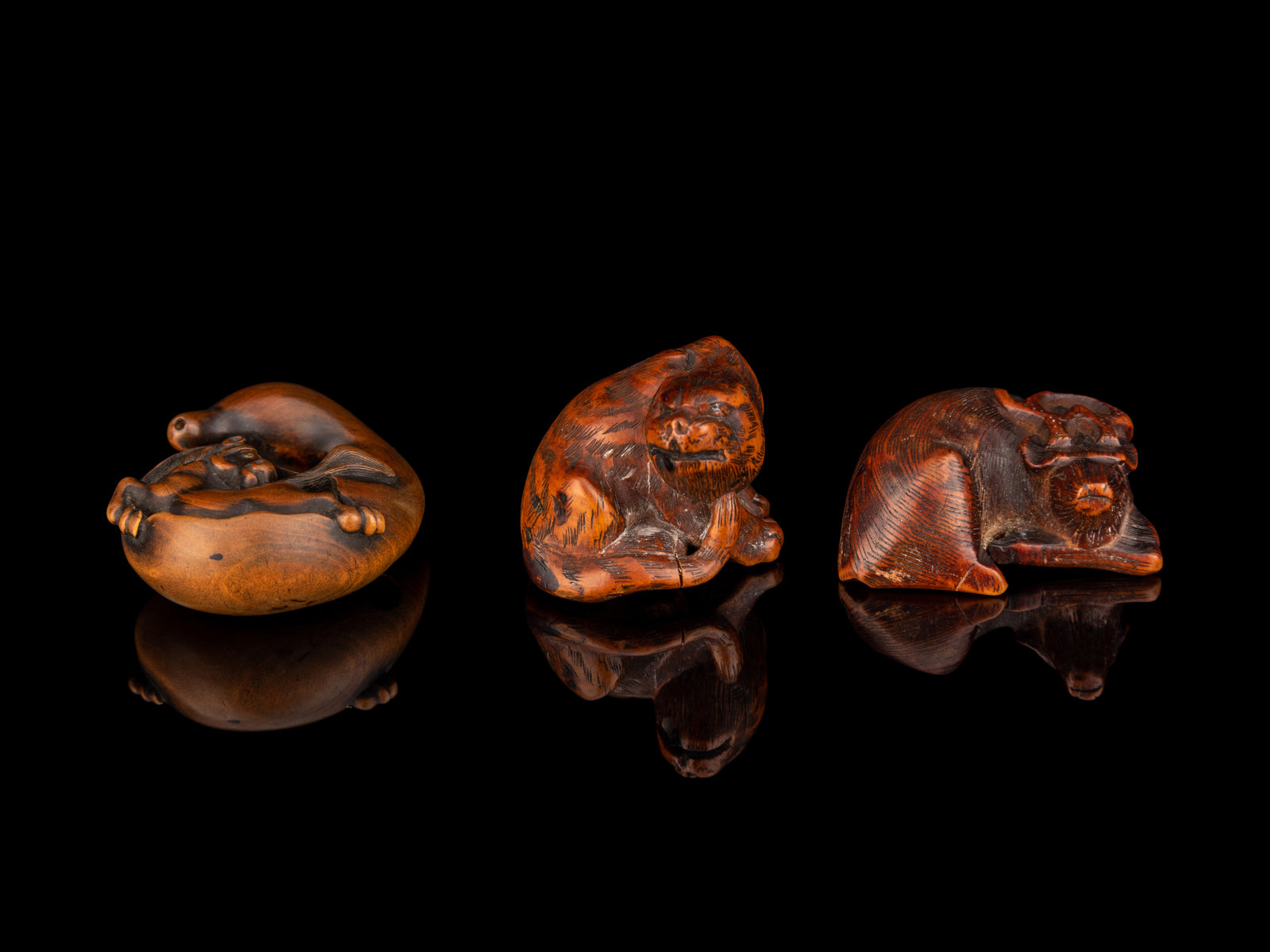 Appraisal: Three Japanese Carved Boxwood Netsuke TH CENTURY the first example