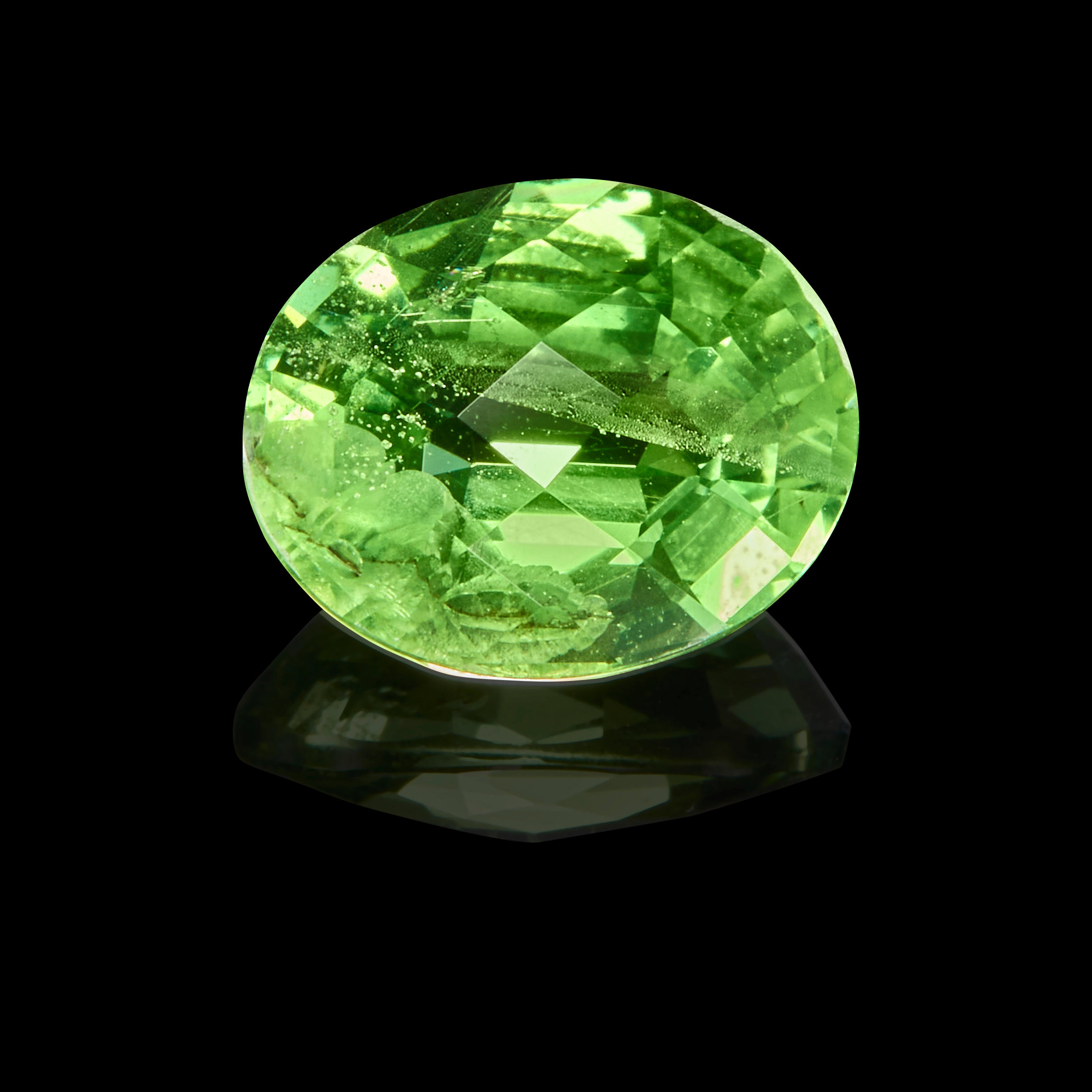 Appraisal: GARNET VAR TSAVORITE Kenya An oval-cut tsavorite with an attractive