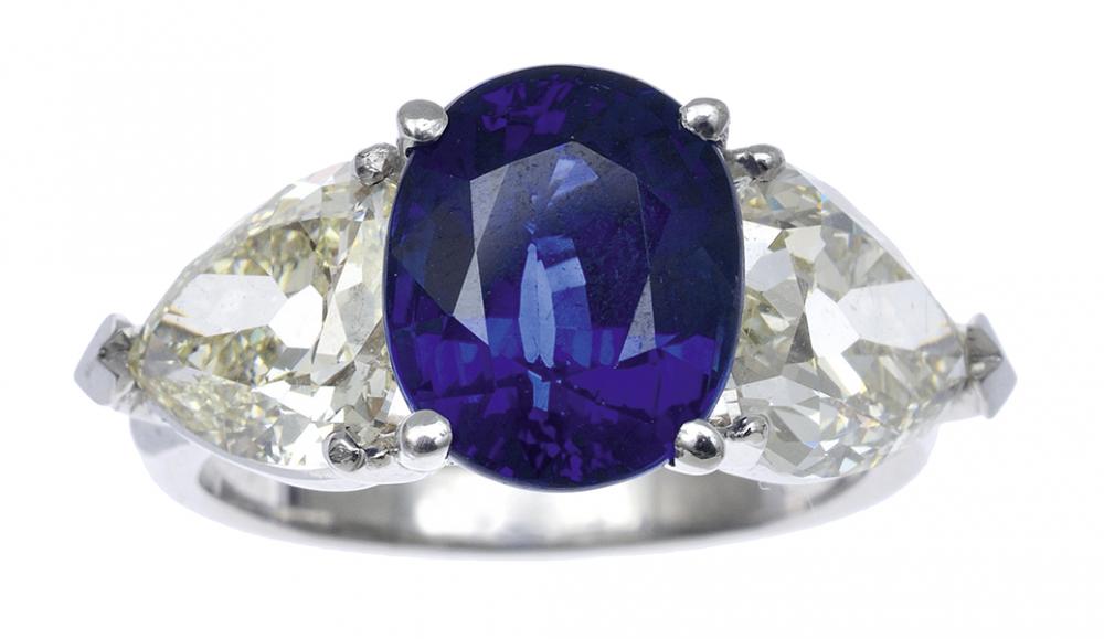 Appraisal: AN IMPRESSIVE SAPPHIRE AND DIAMOND RING Featuring a fine blue