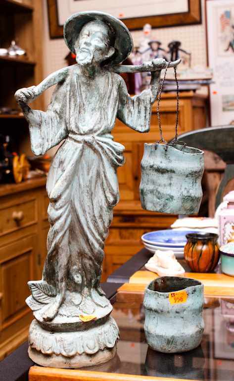 Appraisal: Patinated metal garden figure of an oriental man Estimate -