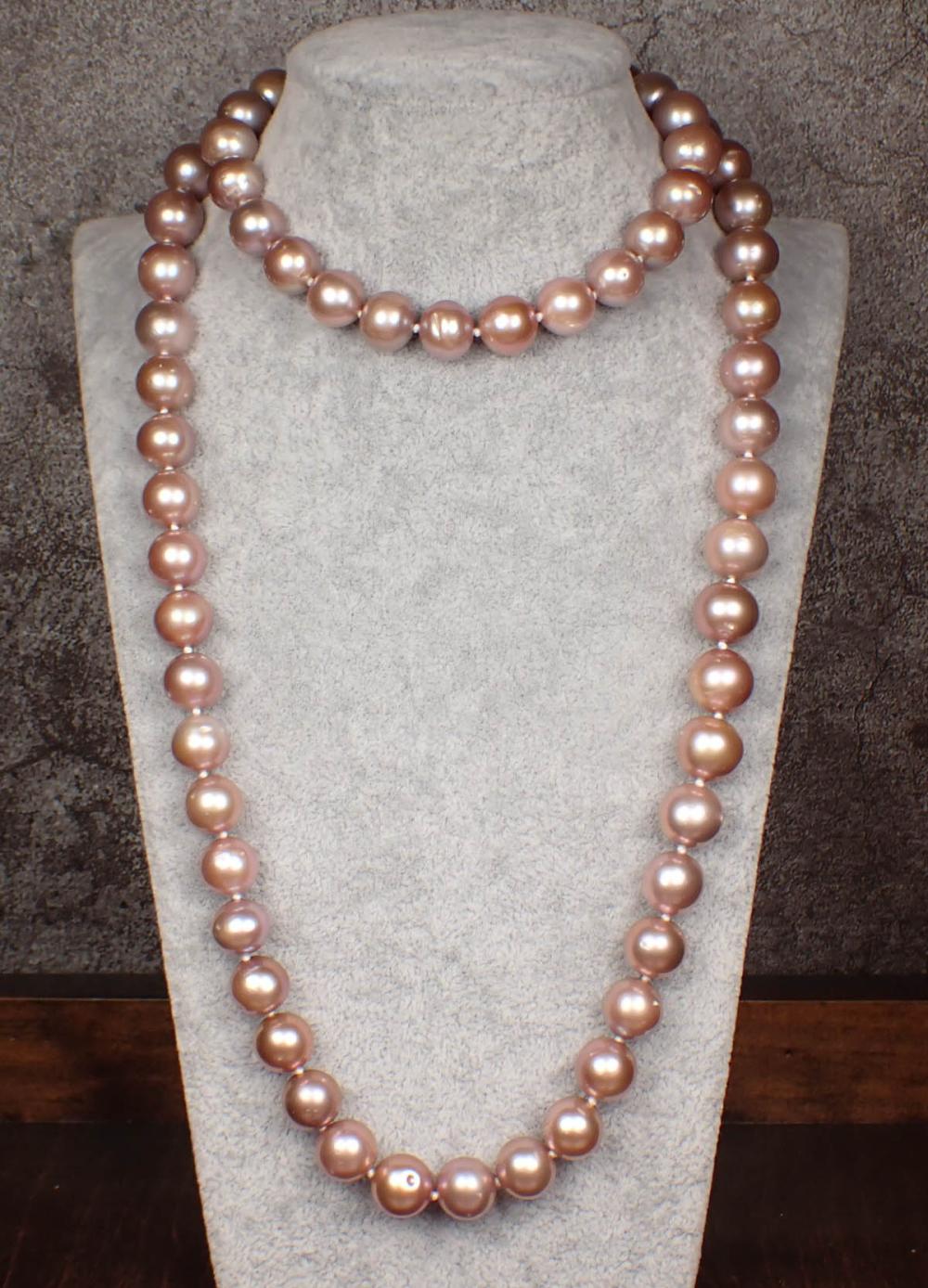 Appraisal: OPERA LENGTH PINK PEARL NECKLACE The hand-knotted strand with well