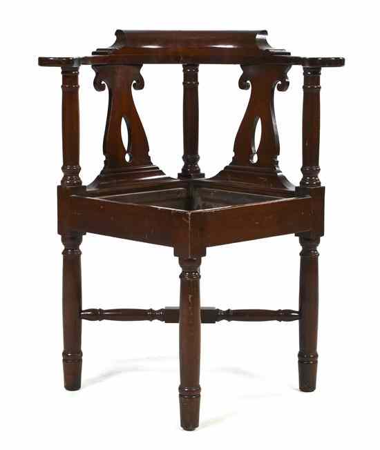 Appraisal: A Georgian Style Mahogany Corner Chair having a rounded back