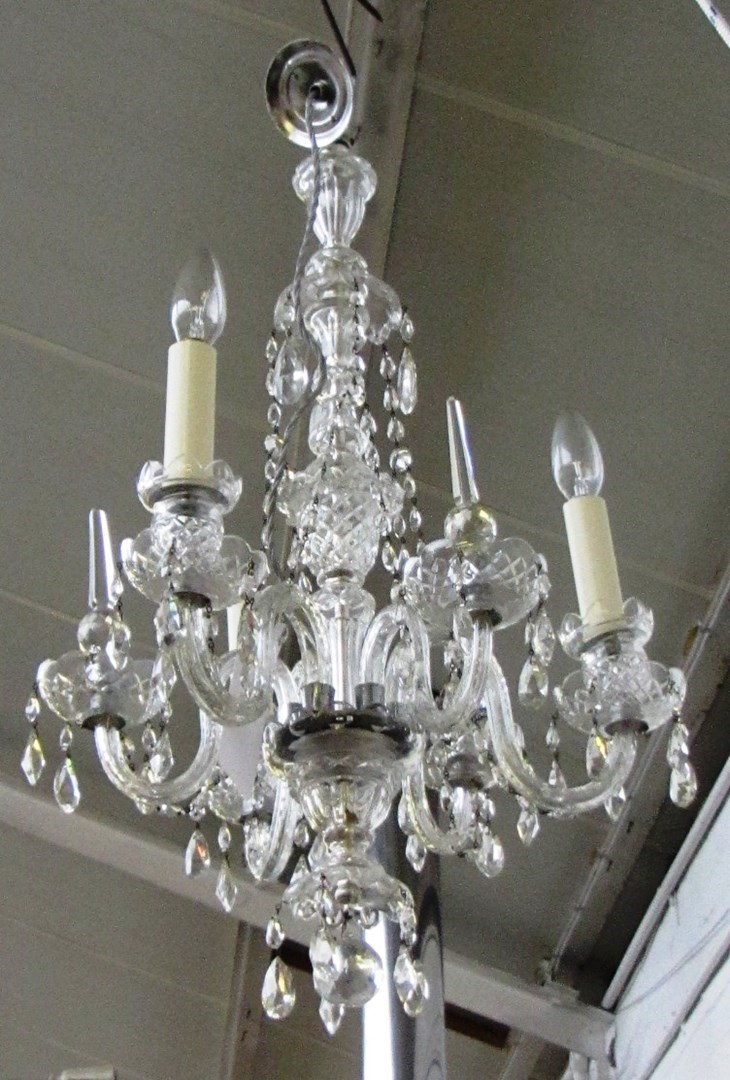 Appraisal: A modern crystal six branch chandelier the shaped stem issuing