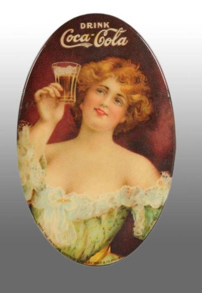 Appraisal: Coca-Cola Celluloid Pocket Mirror Description From the Painting by Wolf