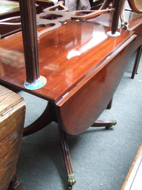 Appraisal: A th century mahogany drop flap table with single end