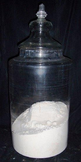 Appraisal: A large glass dispensing jar the lid with faceted finial