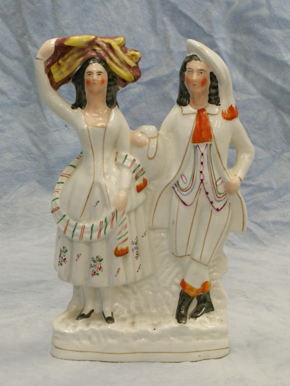 Appraisal: Staffordshire figurine Man and Woman in Hats no damage