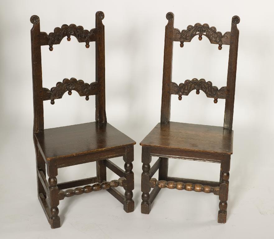 Appraisal: PAIR OF OAK BACK-STOOLS c POSSIBLY YORKSHIRE each carved with